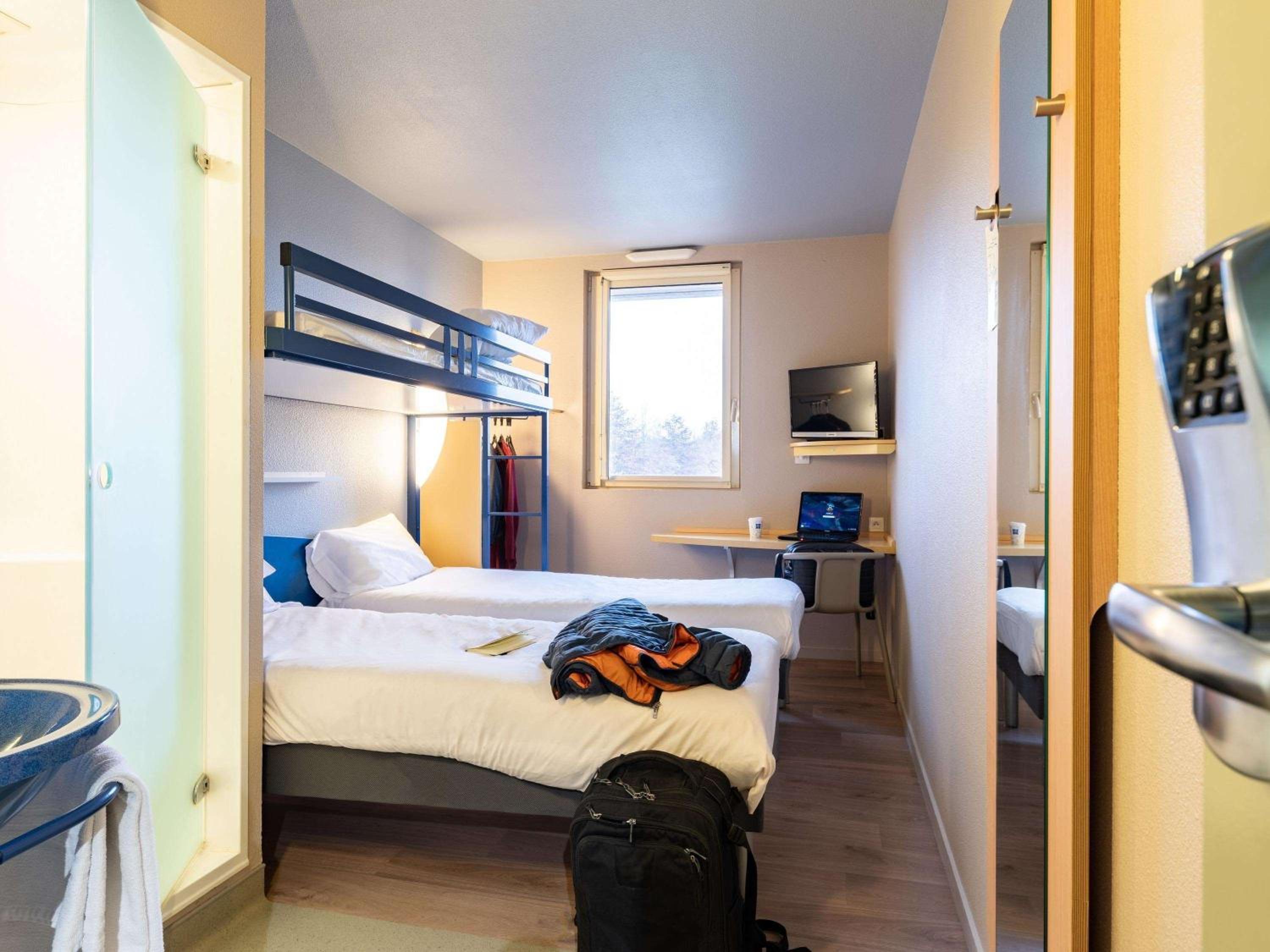 Standard Room with Two twin beds and One bunk bed - Photo 1