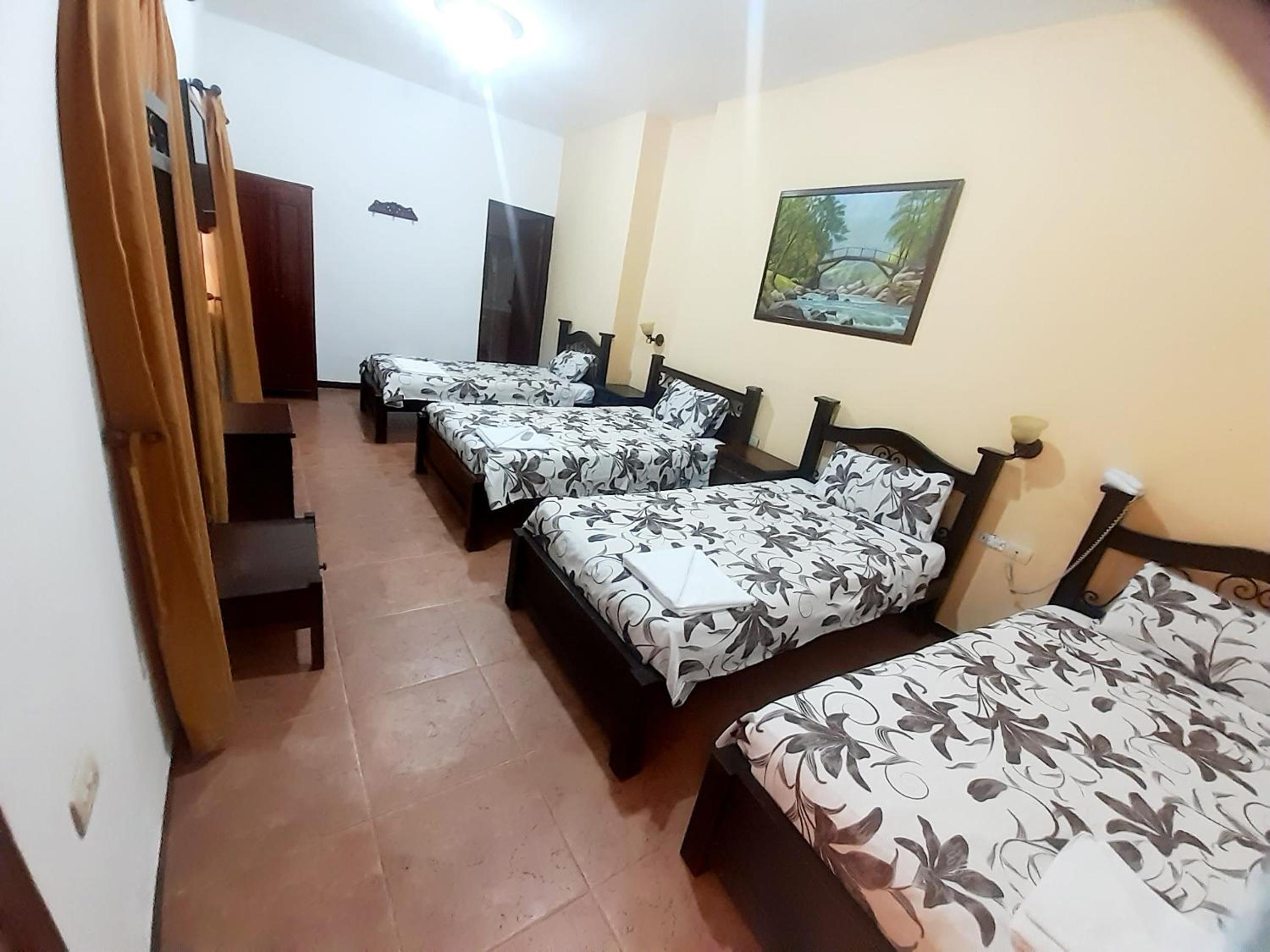 Quadruple Room with Private Bathroom photo 1