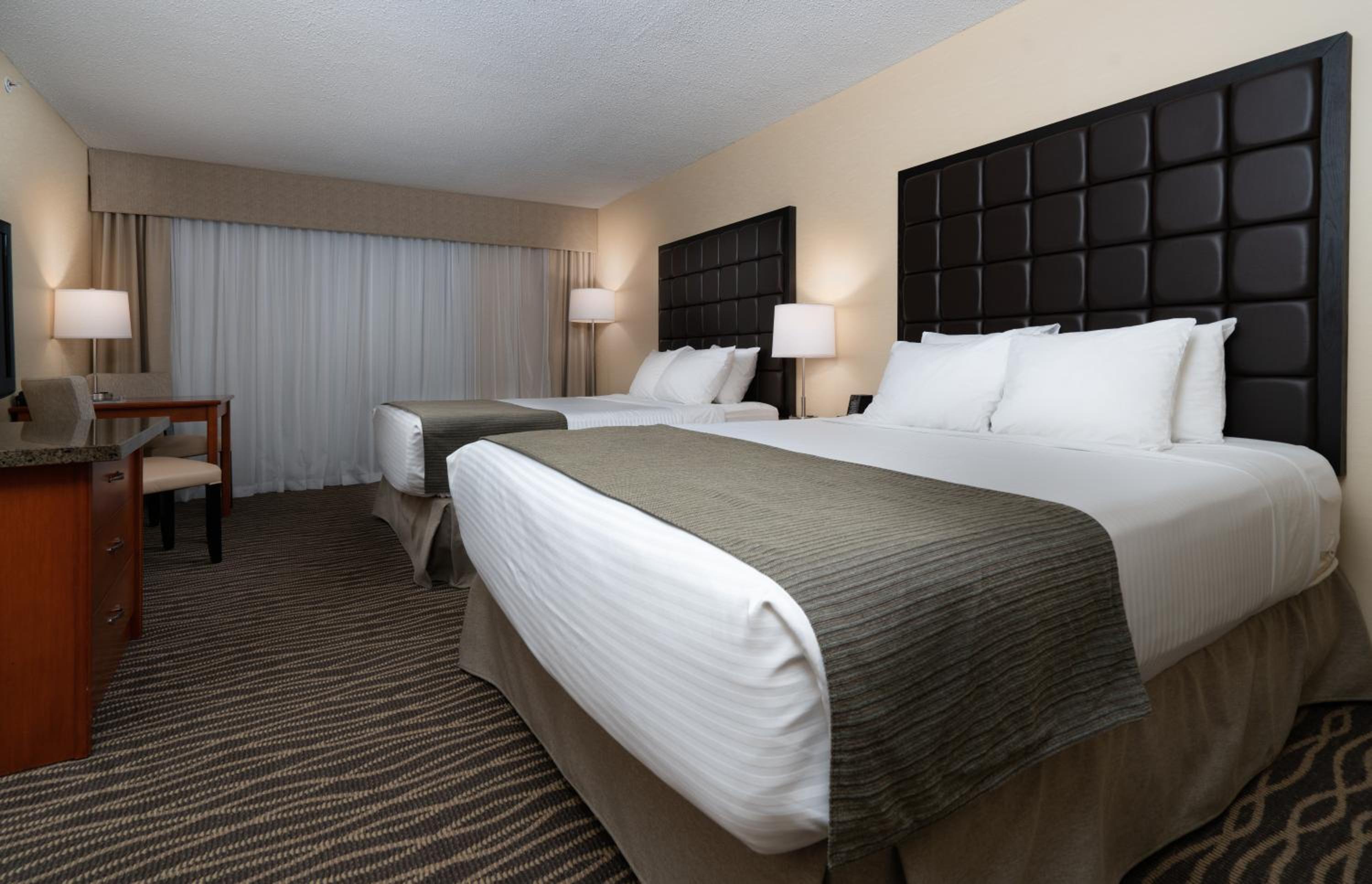 Standard Queen Room with Two Queen Beds - Ground Floor No View - Photo 1