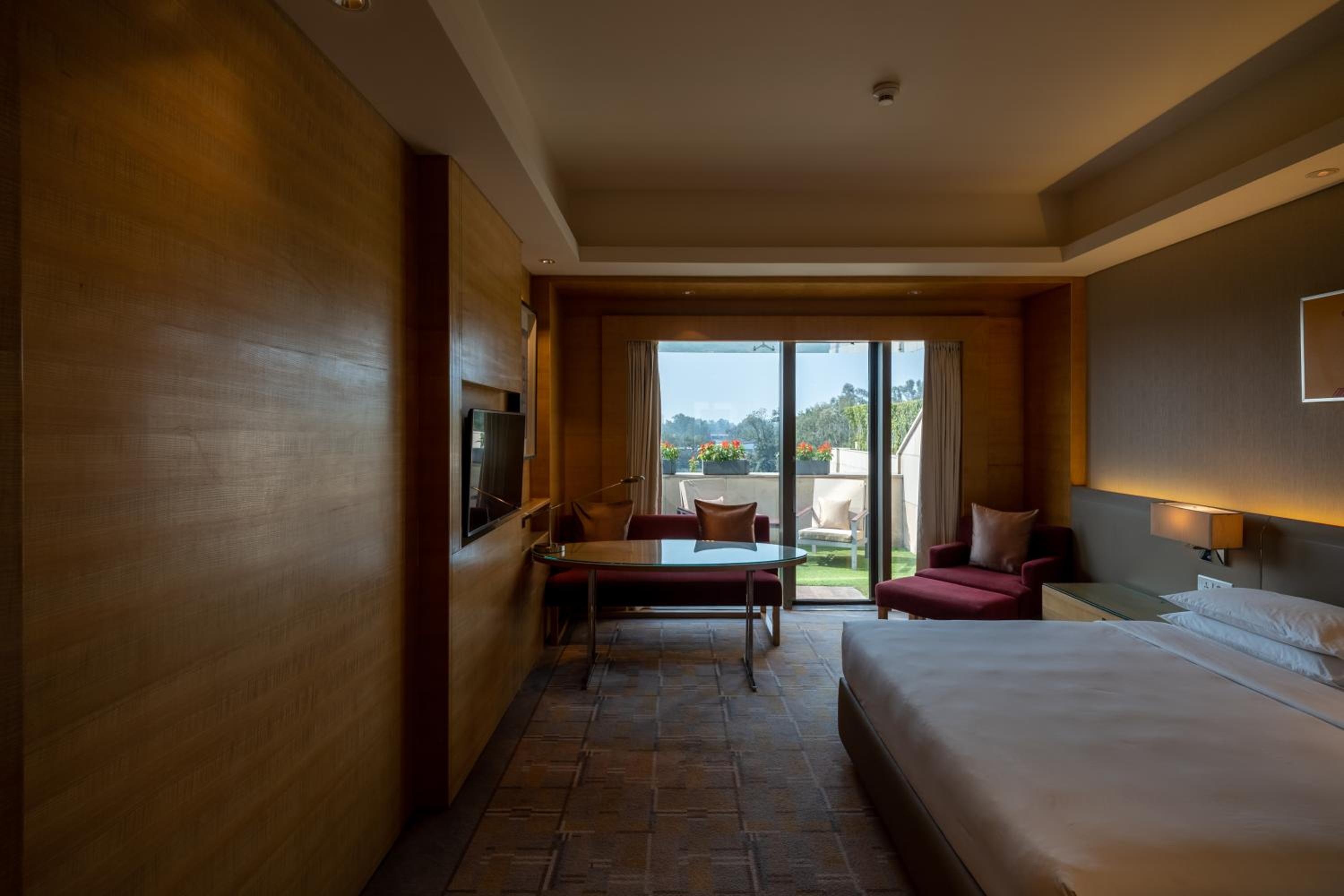 King Bed Pool View, Balcony with Bathtub & Club Access with Unlimited Complimentary IMFL beverages from 18:00 HRS to 20:00 HRS