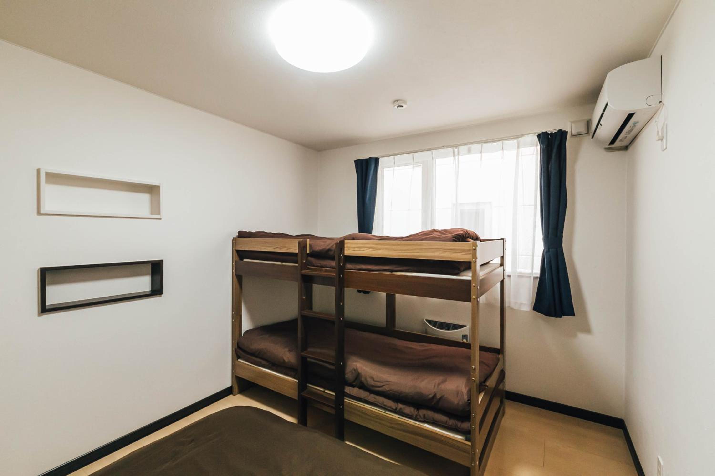 Three-Bedroom House - Photo 16