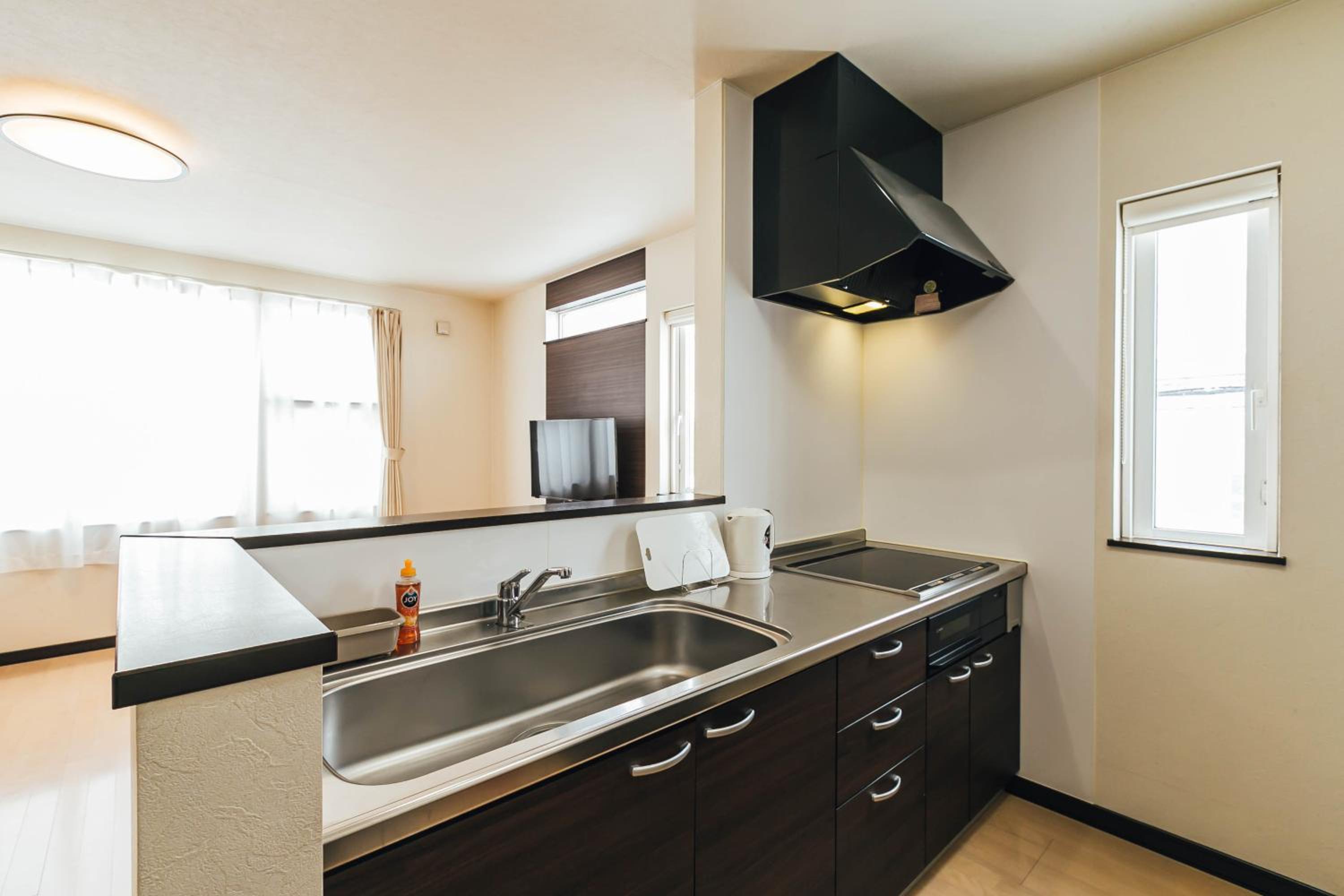 Three-Bedroom House - Photo 4