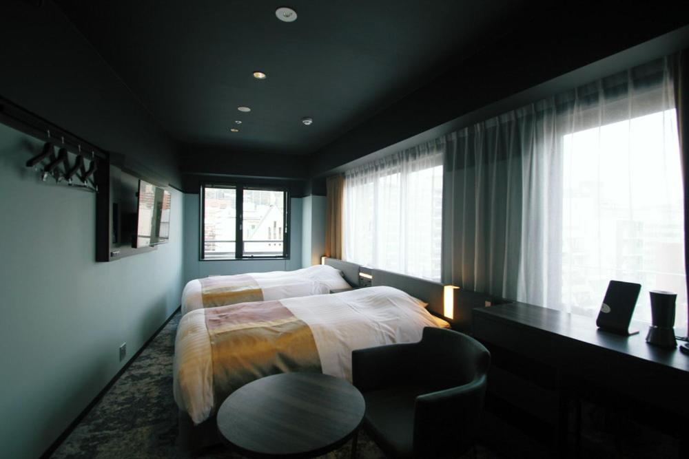 Deluxe Twin Room (with Extra Bed from 3 Adults) - Photo 1