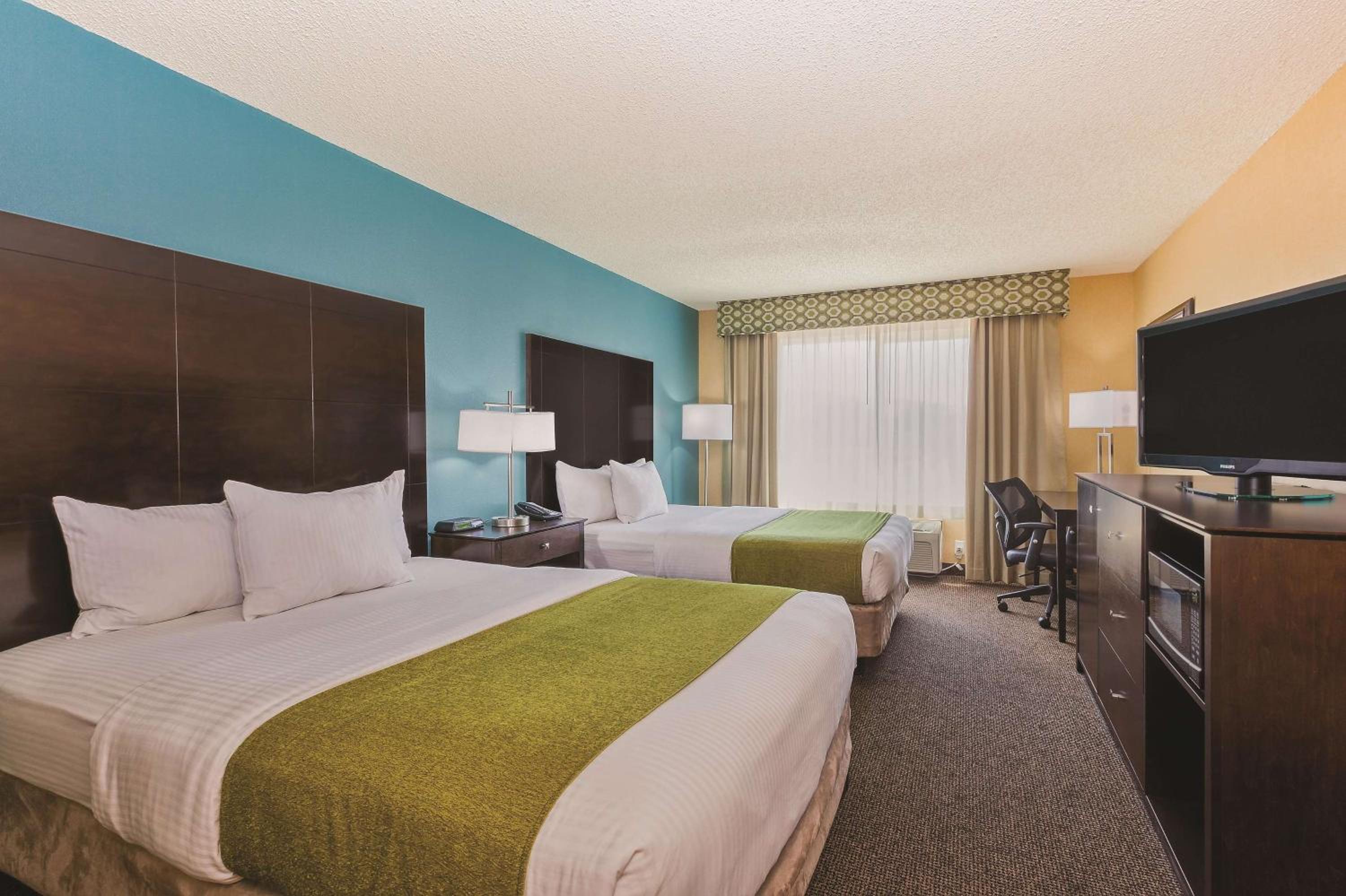 Queen Room with Two Queen Beds - Photo 1