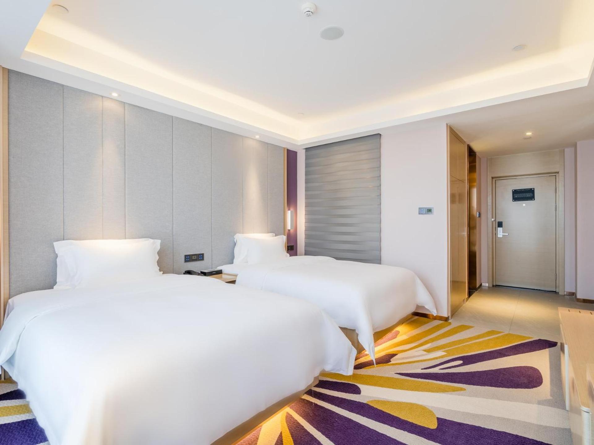 Deluxe Twin Bedroom - Photo 1