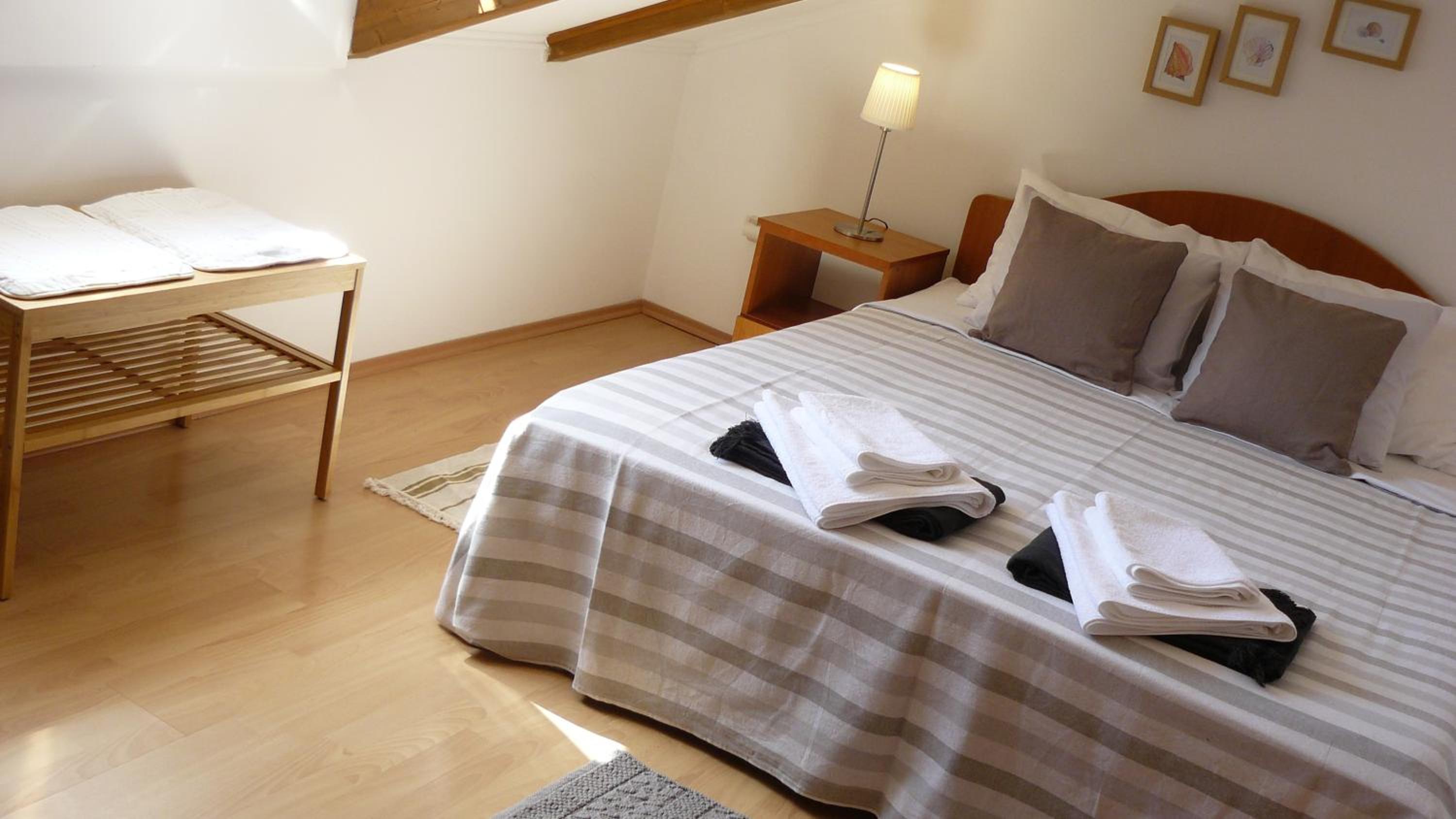 One-Bedroom Apartment with Balcony and Garden View - Attic photo 1