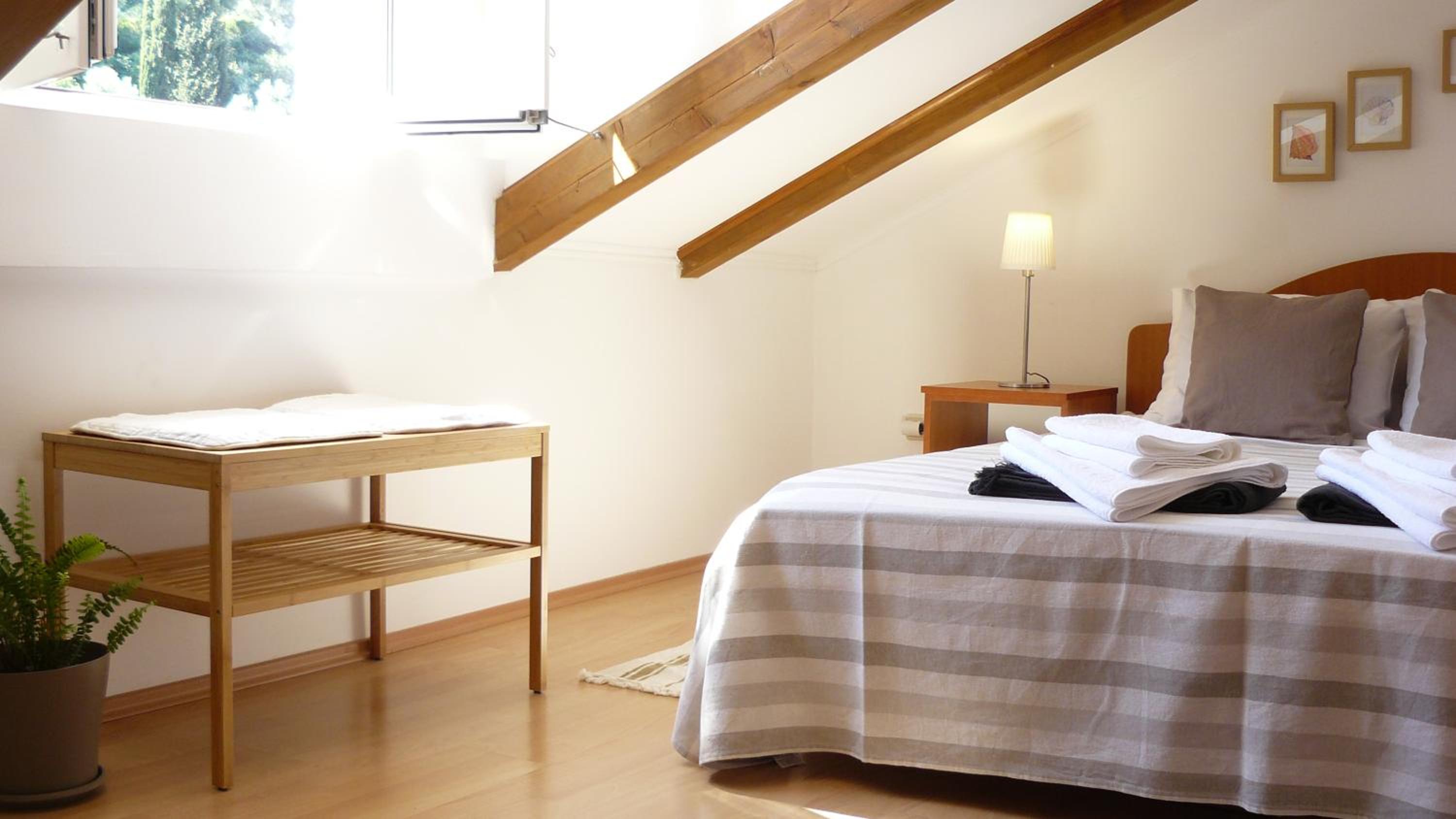 One-Bedroom Apartment with Balcony and Garden View - Attic photo 2