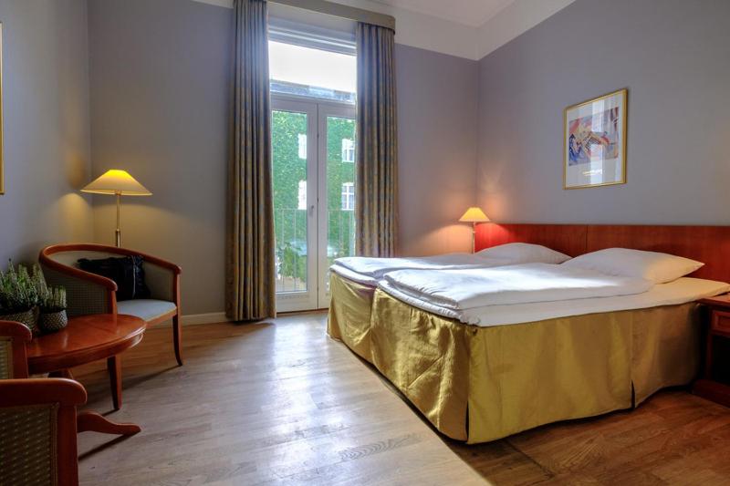Efficient Family Room with King Bed and Non-Private Sofa Bed