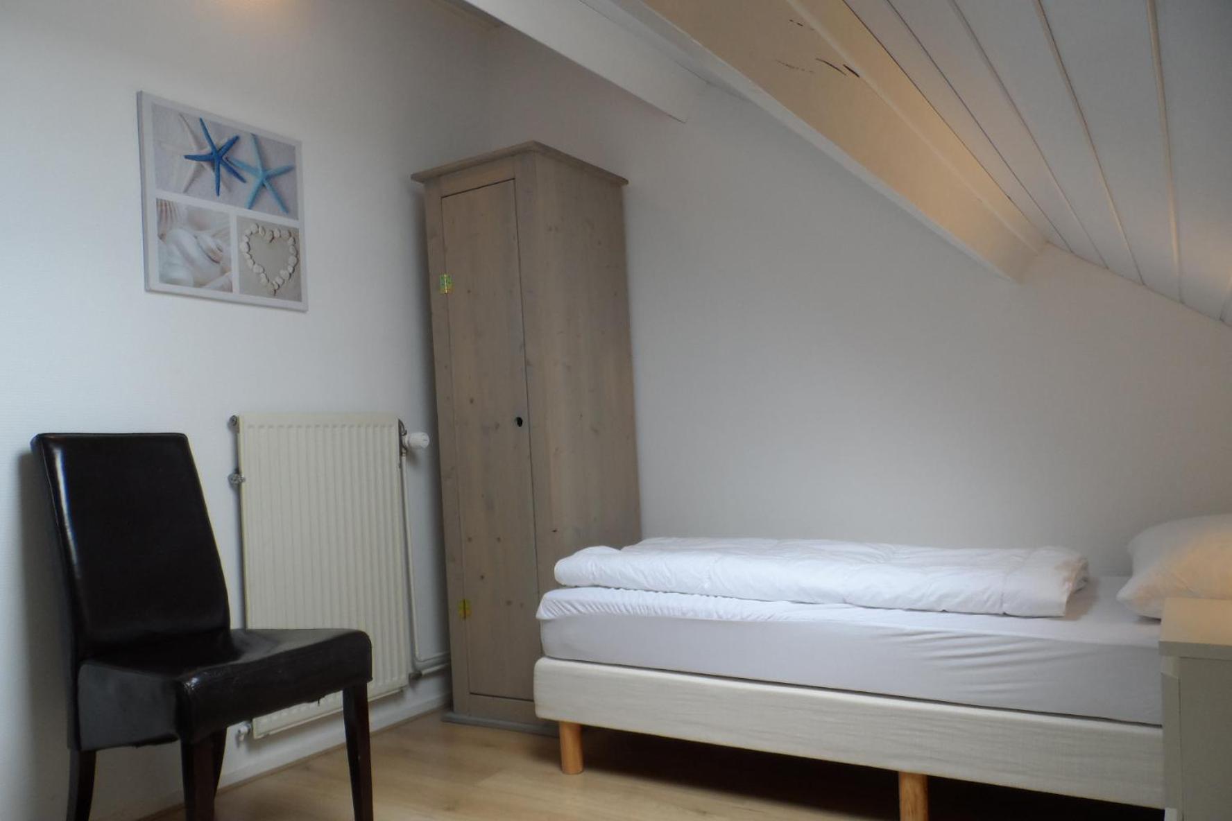 Three-Bedroom Apartment - Photo 12