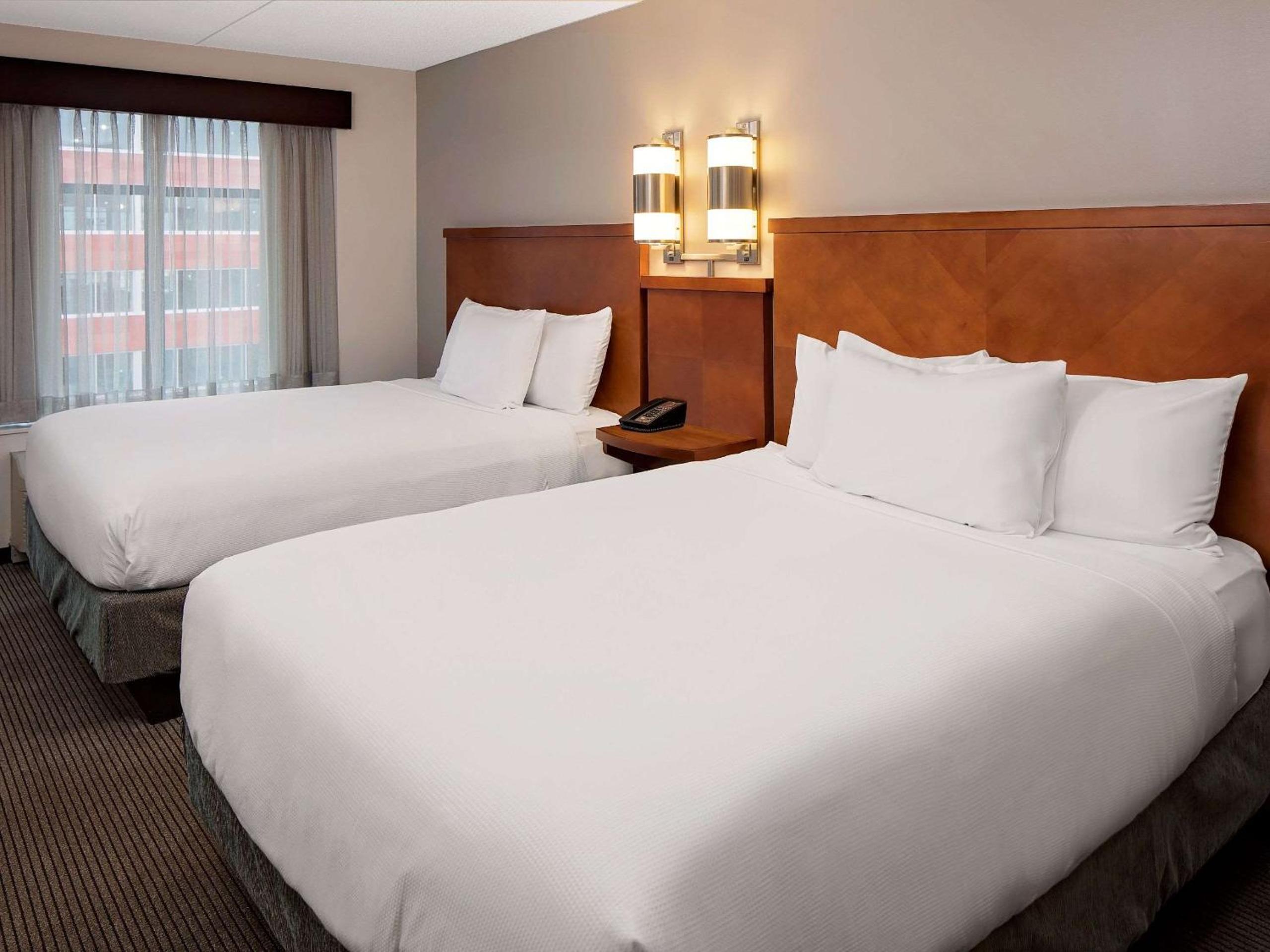 Queen Room with Two Queen Beds, Sofa Bed and Accessible Tub - Photo 1