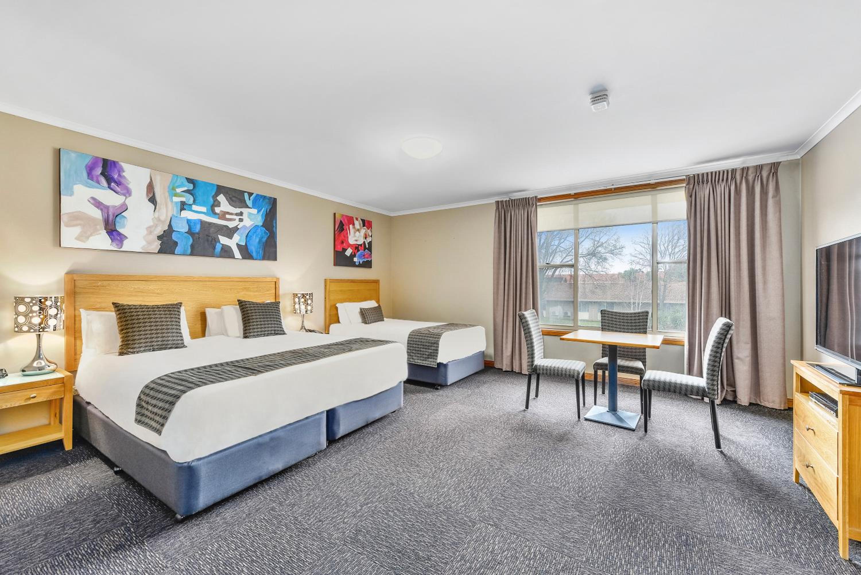 Deluxe Twin Room with King and Single Bed - Photo 1