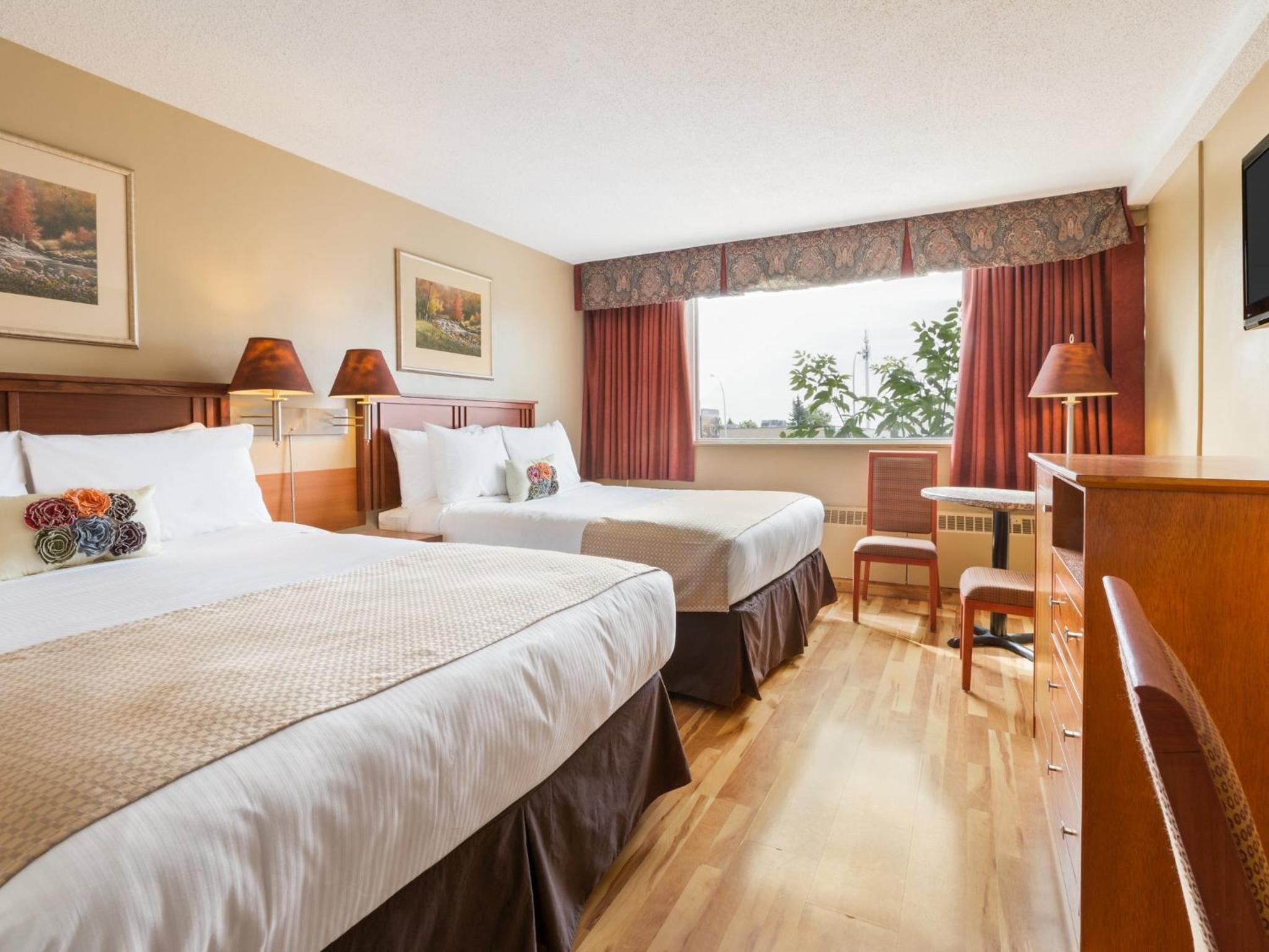 Efficiency Suite with Two Double Beds - Non-Smoking photo 1