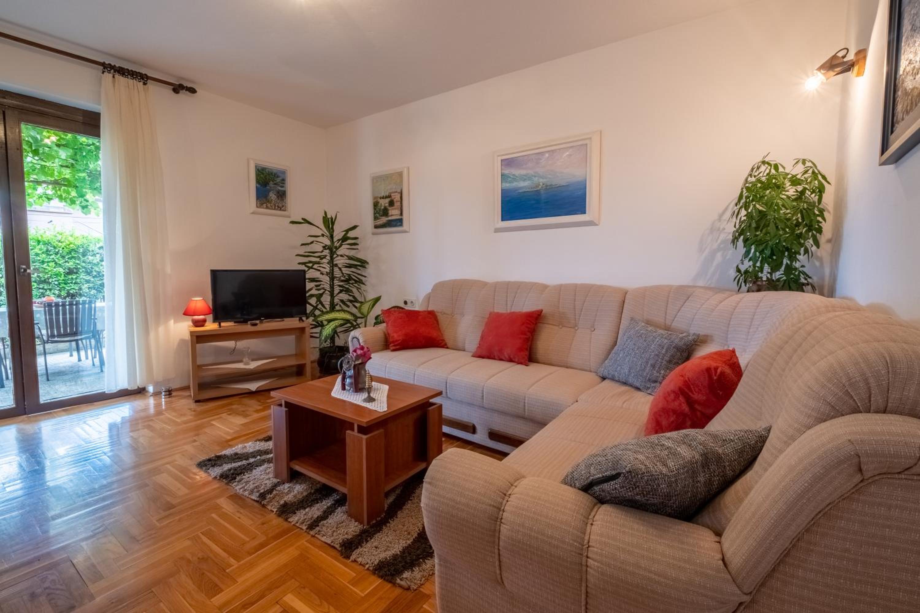 Three-Bedroom Apartment with Patio - Photo 1