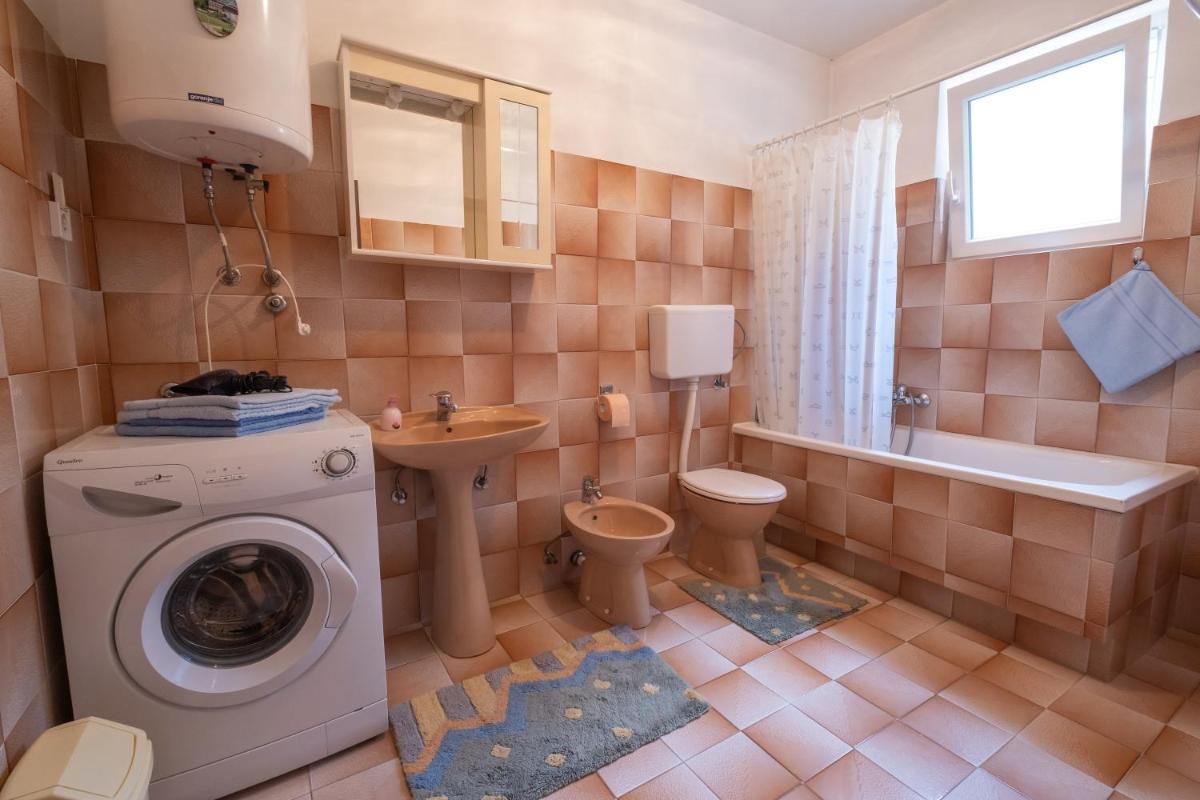 Three-Bedroom Apartment with Patio - Photo 8