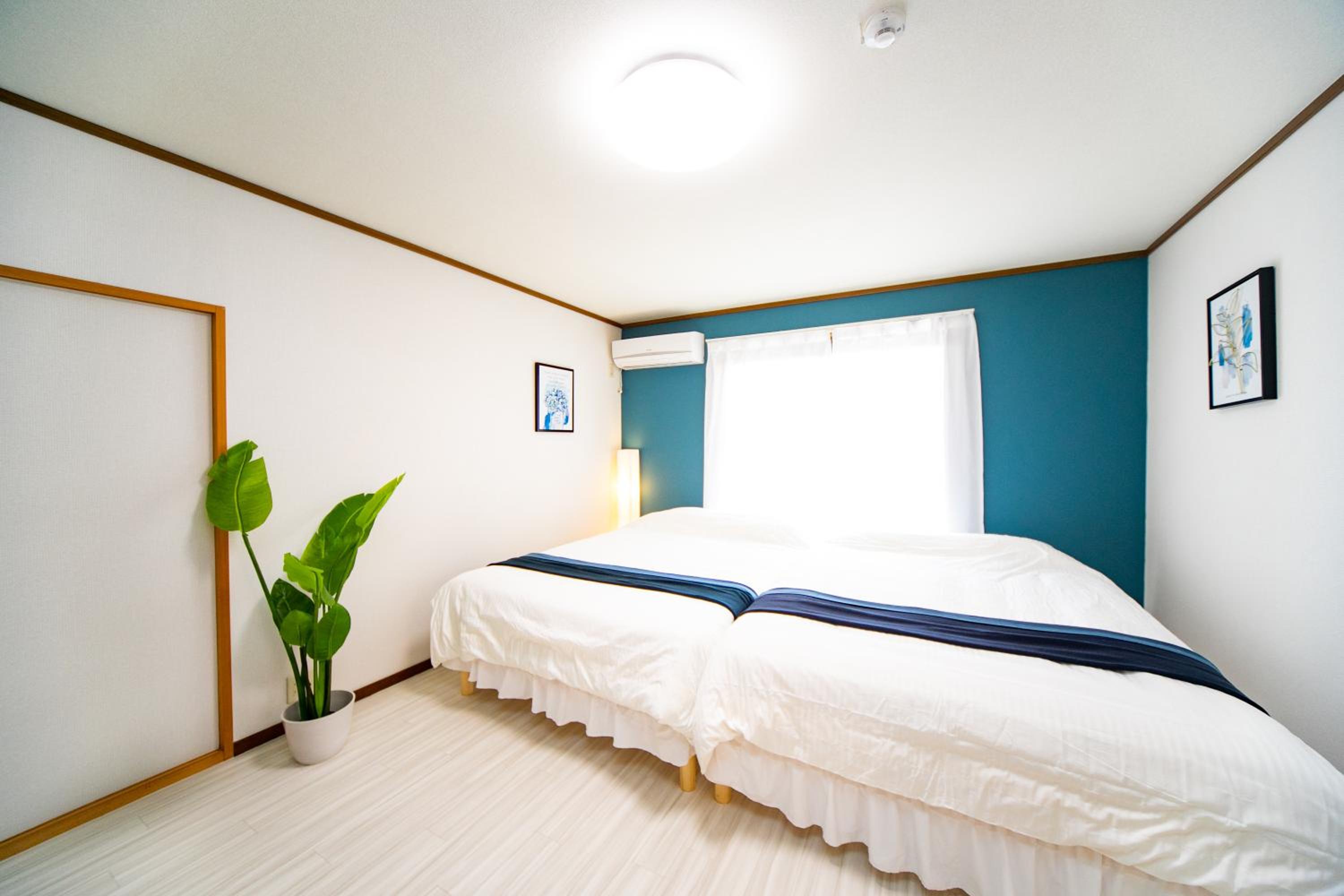 Three-Bedroom House - Photo 31