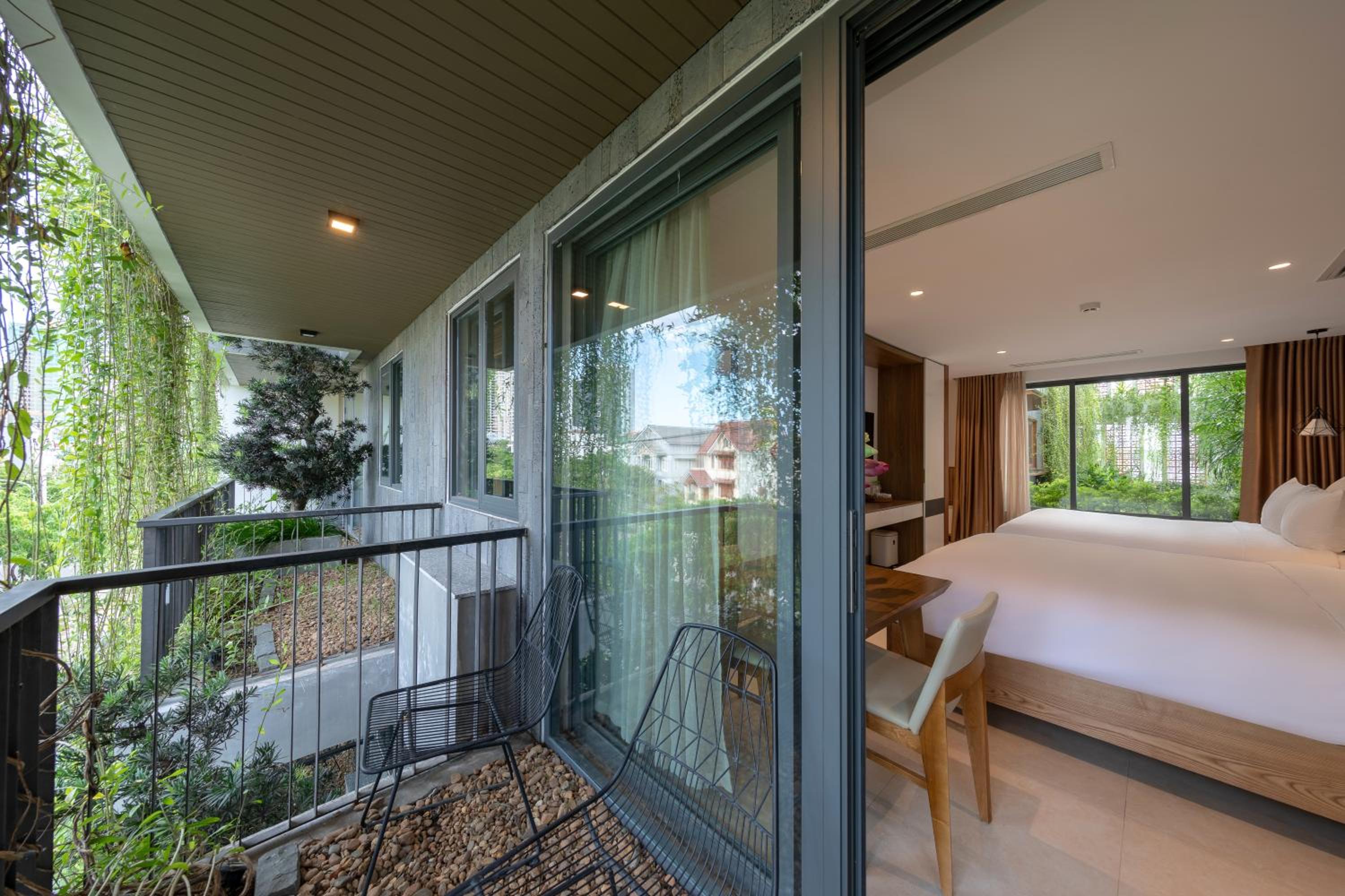 Family Room with Balcony - Street and Pool View