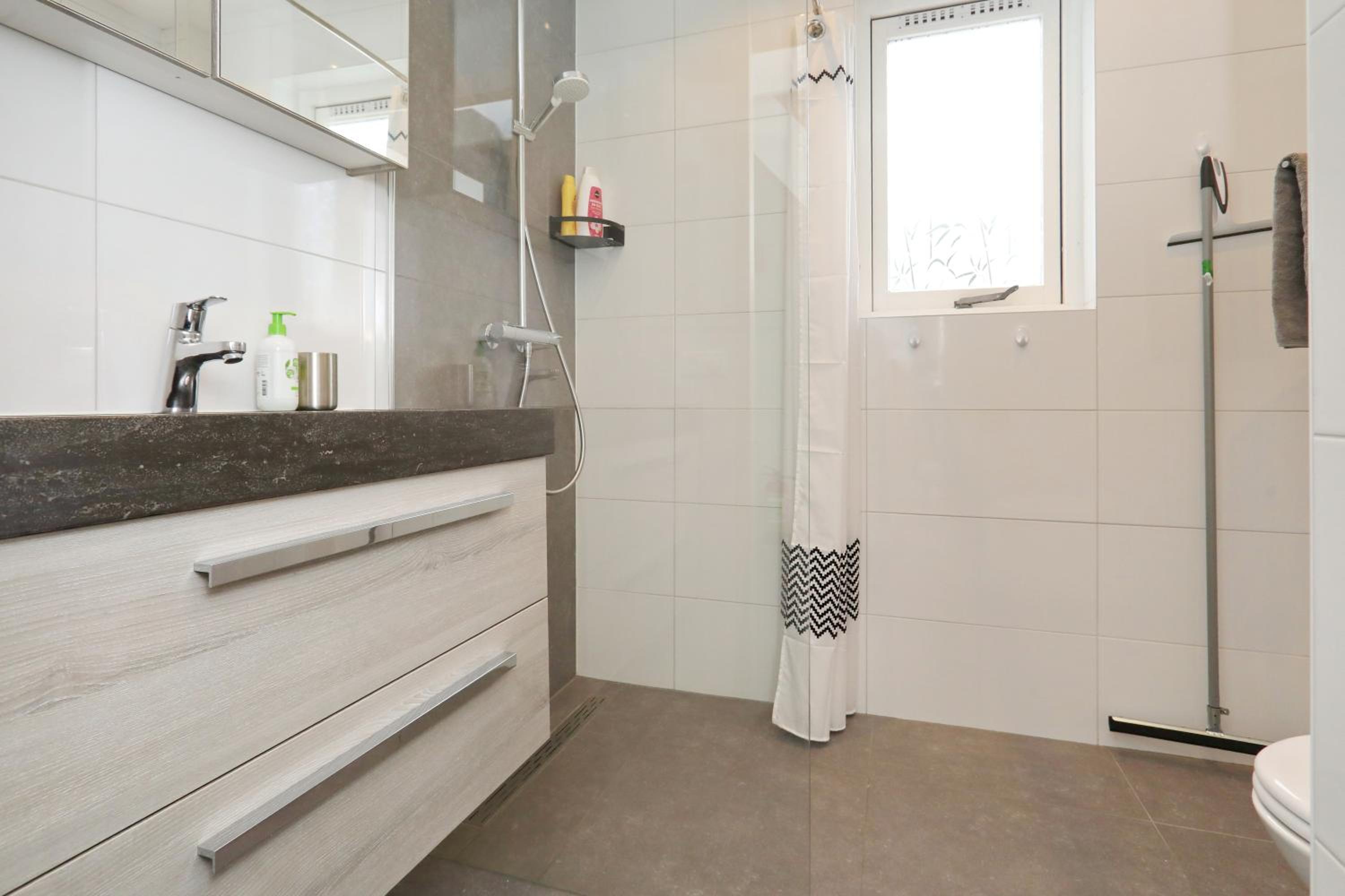 Three-Bedroom House - Photo 23