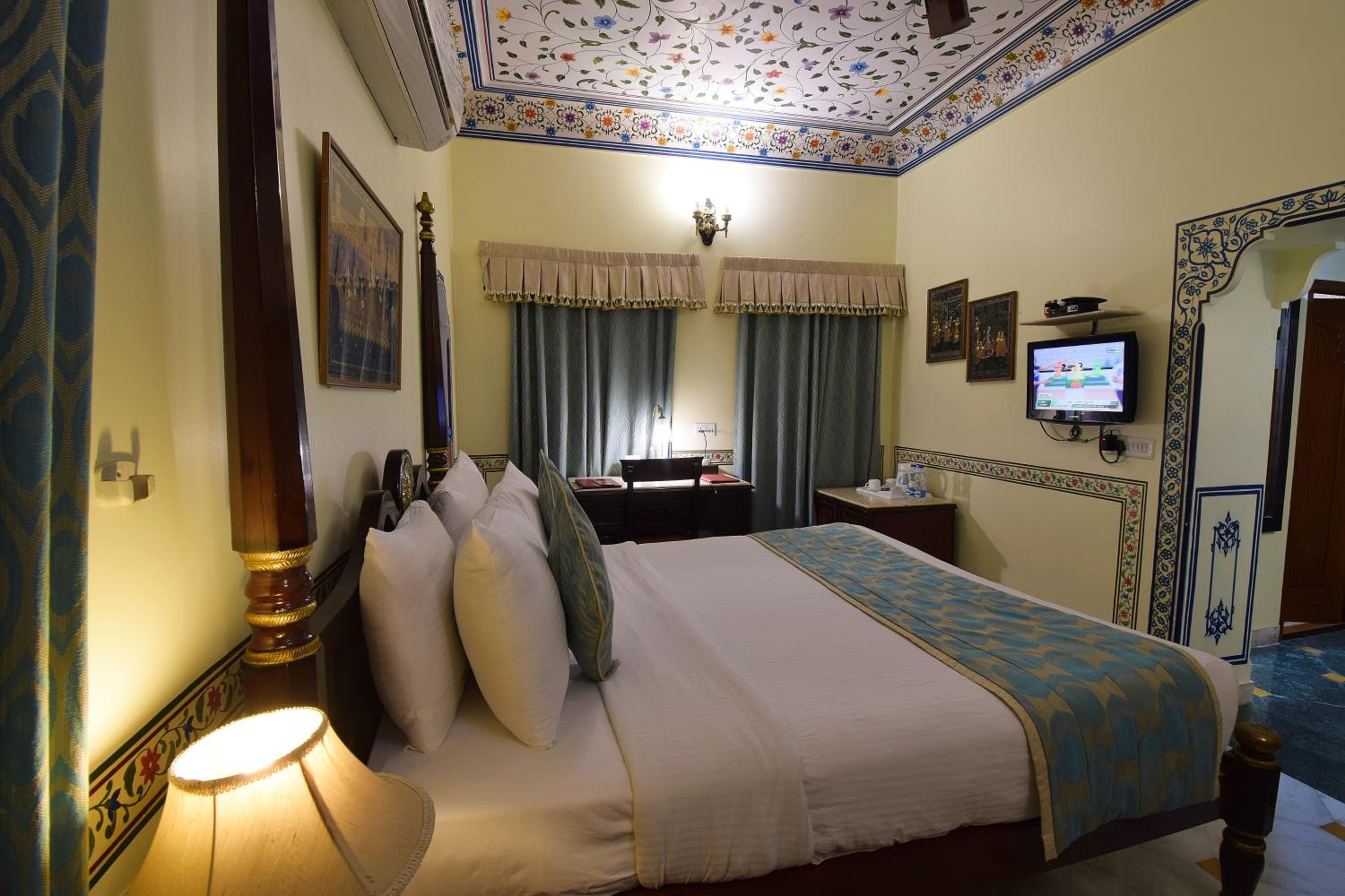 Royal Deluxe Double Room with Car and Chauffeur, Free pickup on arrival from train or bus station, daily Rajasthani dance & music show from 7–9 PM, swimming pool, and a dedicated travel desk to assist with local sightseeing tours and activities - Photo 4