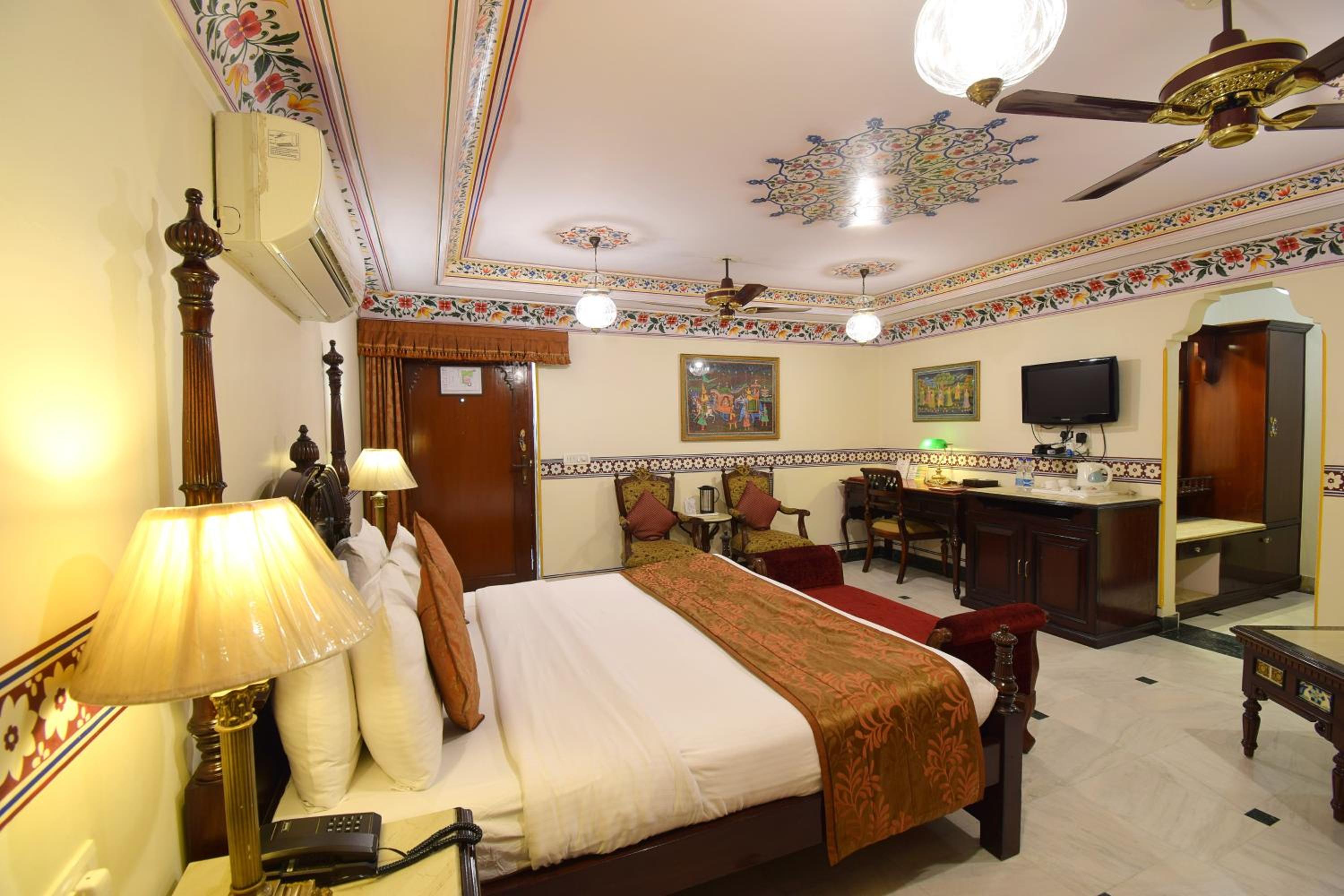 Royal Deluxe Double Room with Car and Chauffeur, Free pickup on arrival from train or bus station, daily Rajasthani dance & music show from 7–9 PM, swimming pool, and a dedicated travel desk to assist with local sightseeing tours and activities - Photo 11