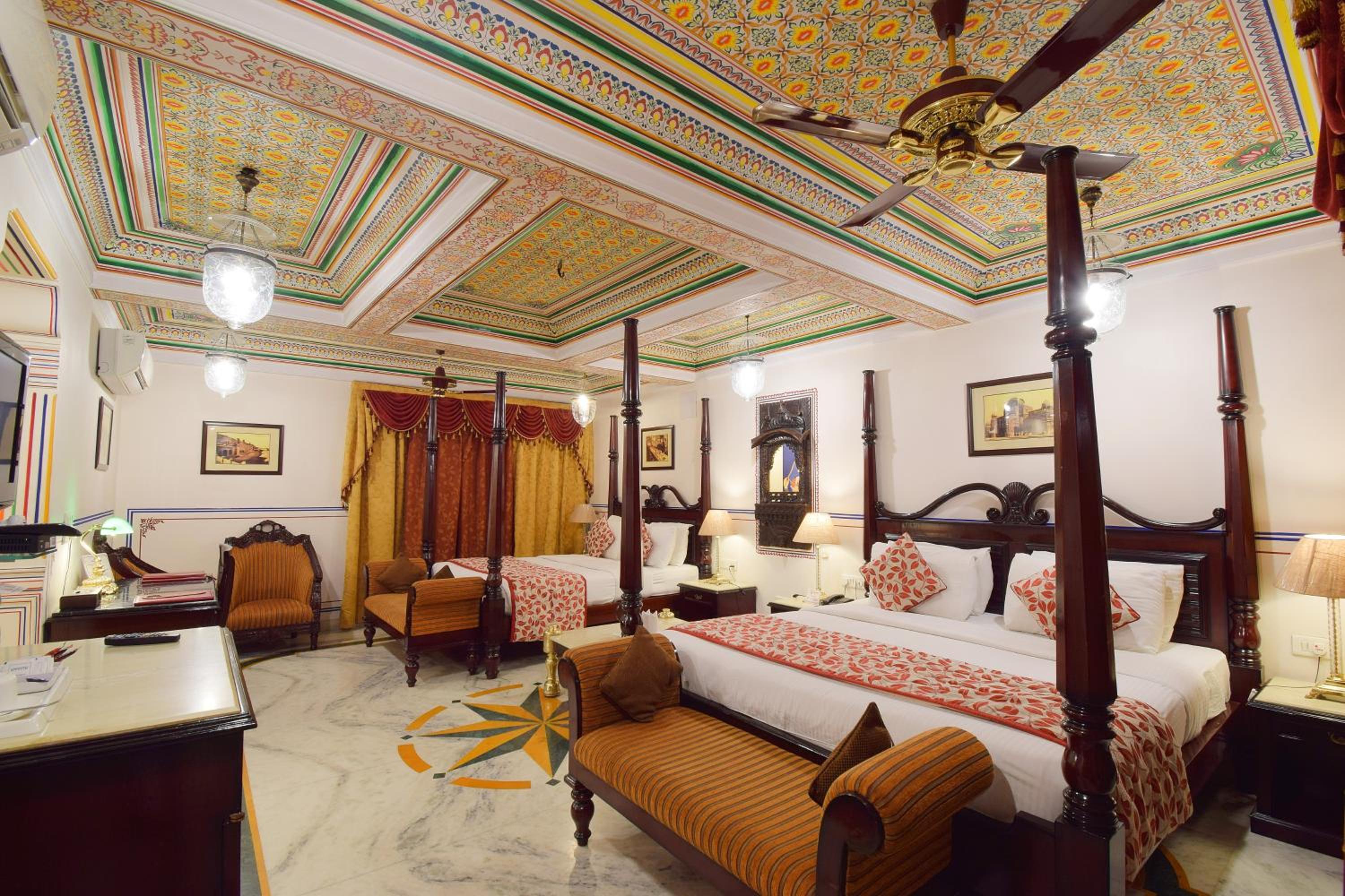Royal Suite Family: Free pickup on arrival from train or bus station. Enjoy a daily Rajasthani dance & music show from 7–9 PM, swimming pool, and a dedicated travel desk to assist with local sightseeing tours, intercity travel arrangements & activities photo 2