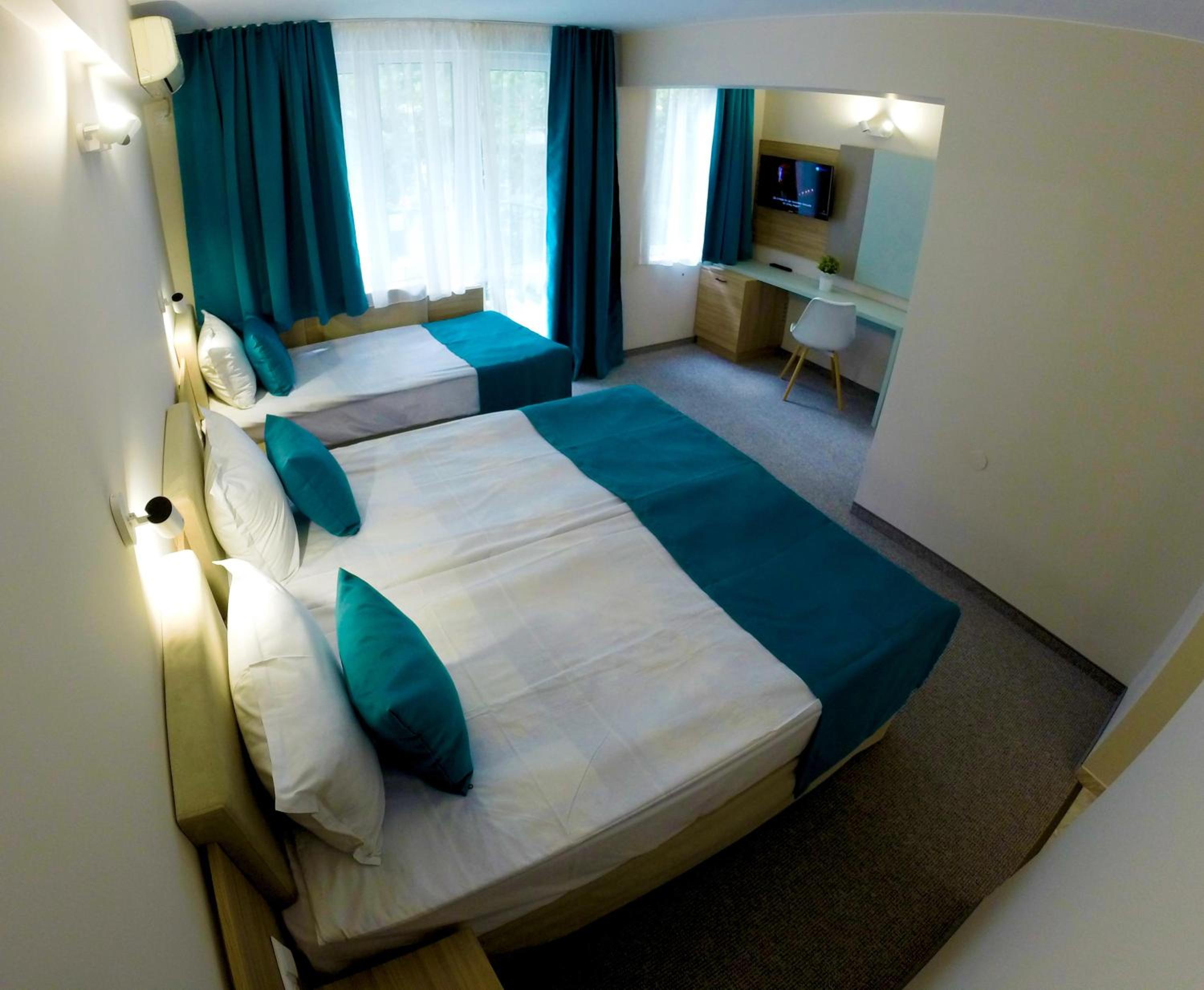 Deluxe Double Room with Balcony (2 Adults + 1 Child)