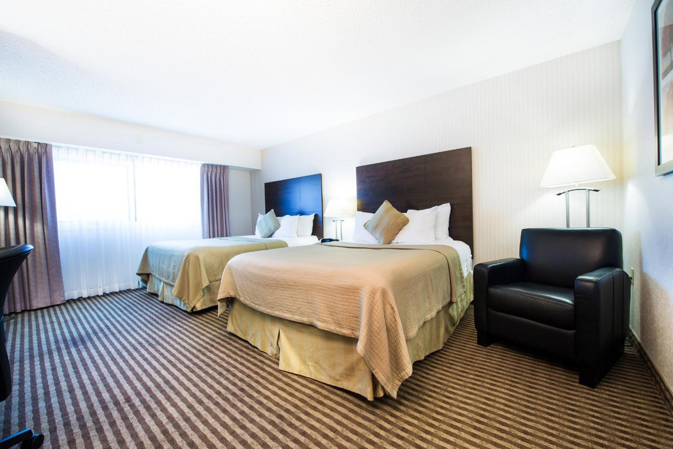 Premier Queen Room with Two Queen Beds - Photo 1