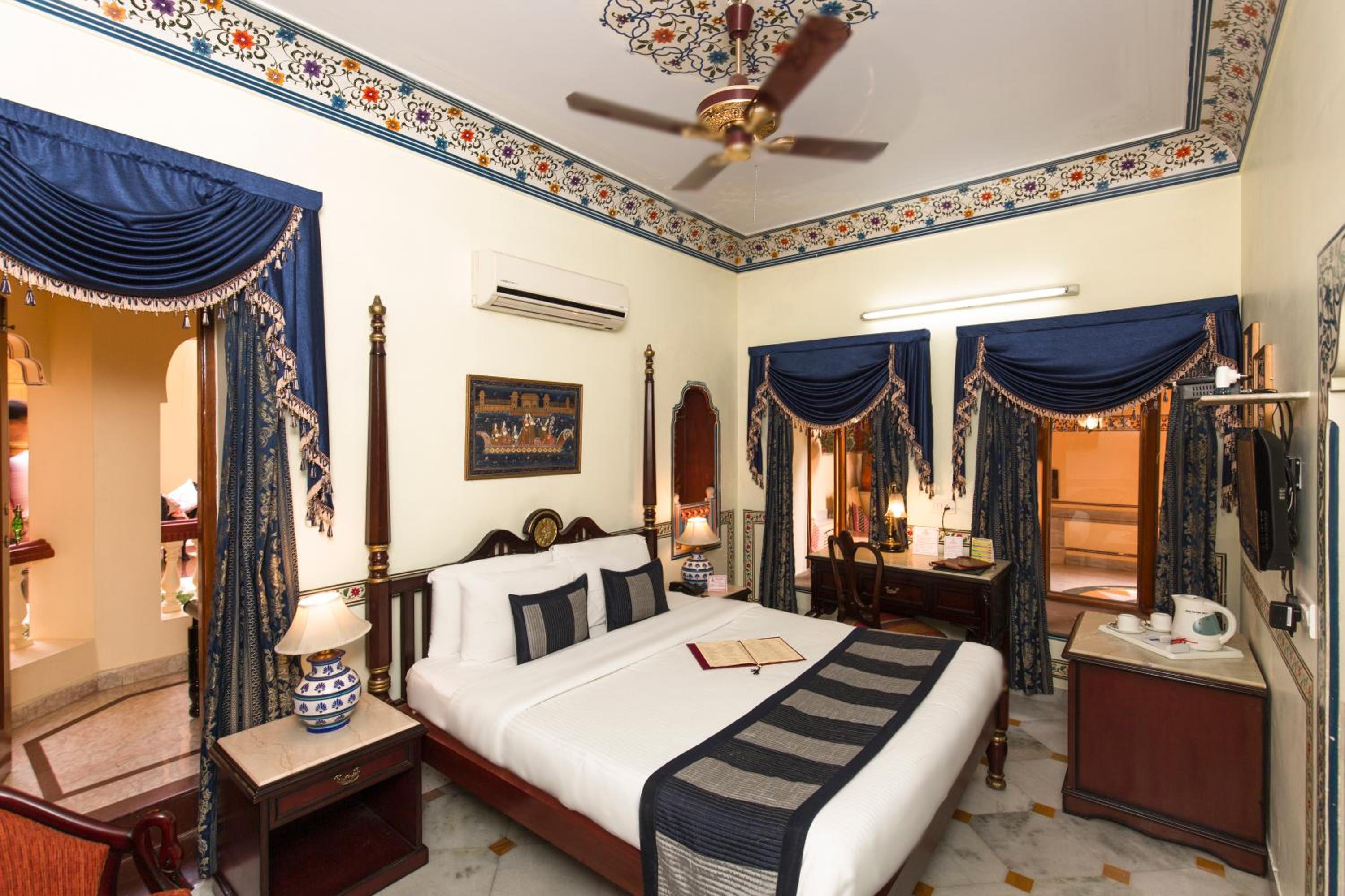 Royal Deluxe Double Room with Car and Chauffeur, Free pickup on arrival from train or bus station, daily Rajasthani dance & music show from 7–9 PM, swimming pool, and a dedicated travel desk to assist with local sightseeing tours and activities - Photo 3