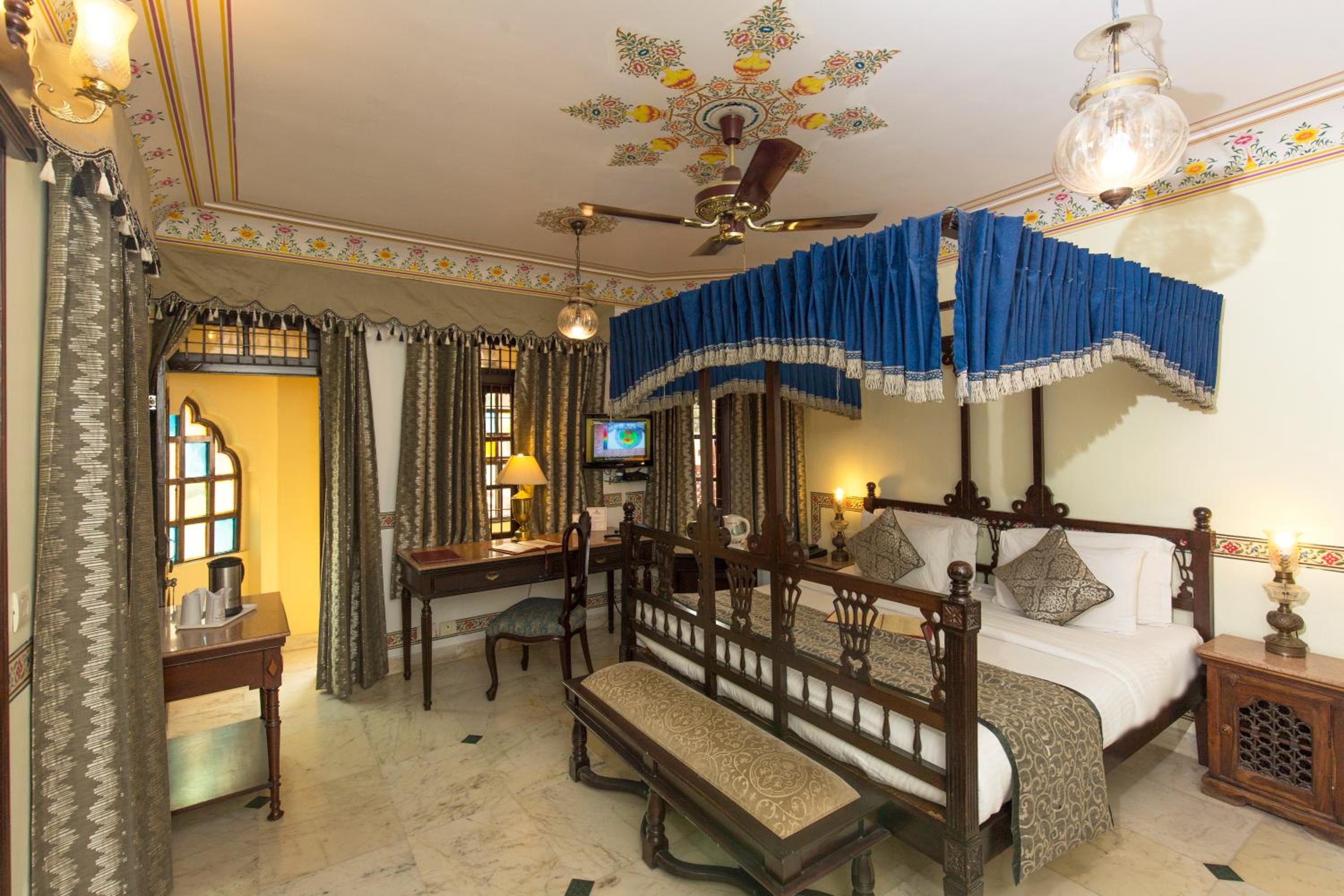 Royal Deluxe Double Room with Car and Chauffeur, Free pickup on arrival from train or bus station, daily Rajasthani dance & music show from 7–9 PM, swimming pool, and a dedicated travel desk to assist with local sightseeing tours and activities - Photo 20