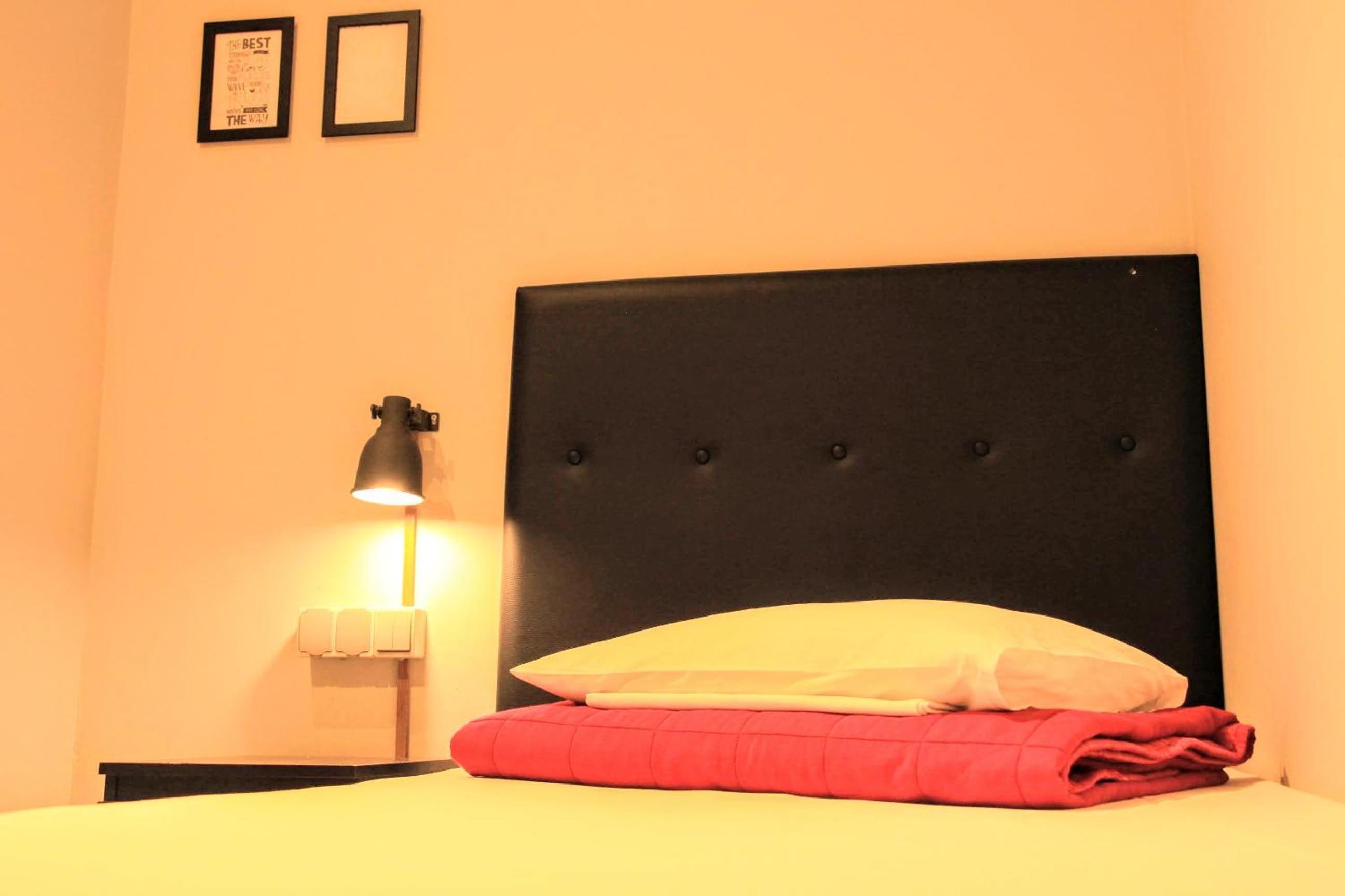 Habitación individual con baño compartido