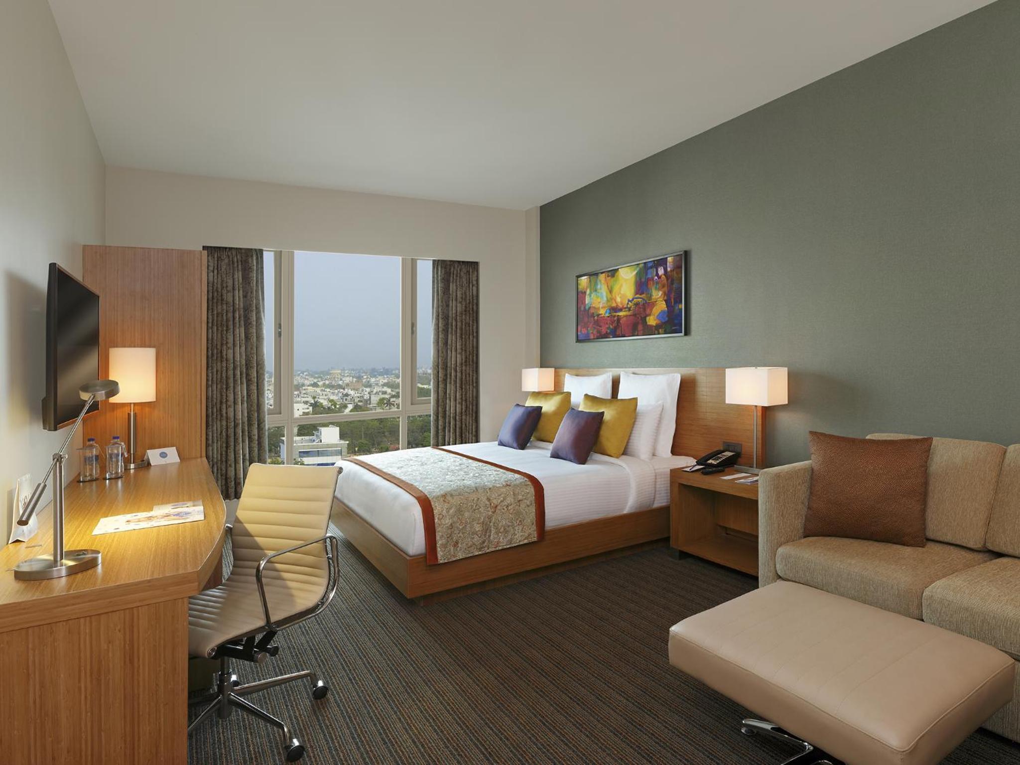 Executive Room | Unlimited IMFL at the Premium Lounge from 6–8 pm, one-way airport transfer, and 20% discounts on F&B, Laundry, Spa, and Transport