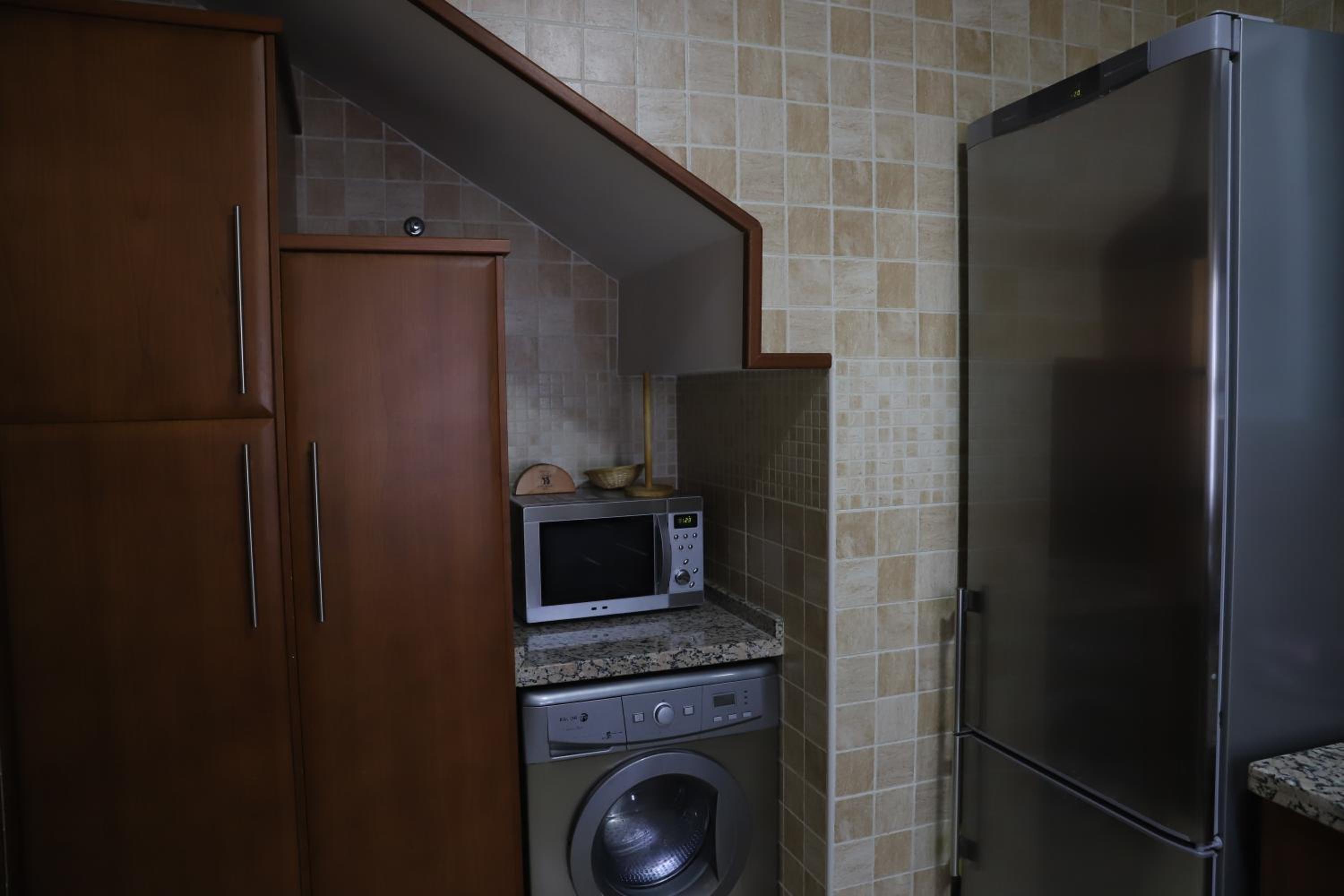 Three-Bedroom Apartment - Photo 66