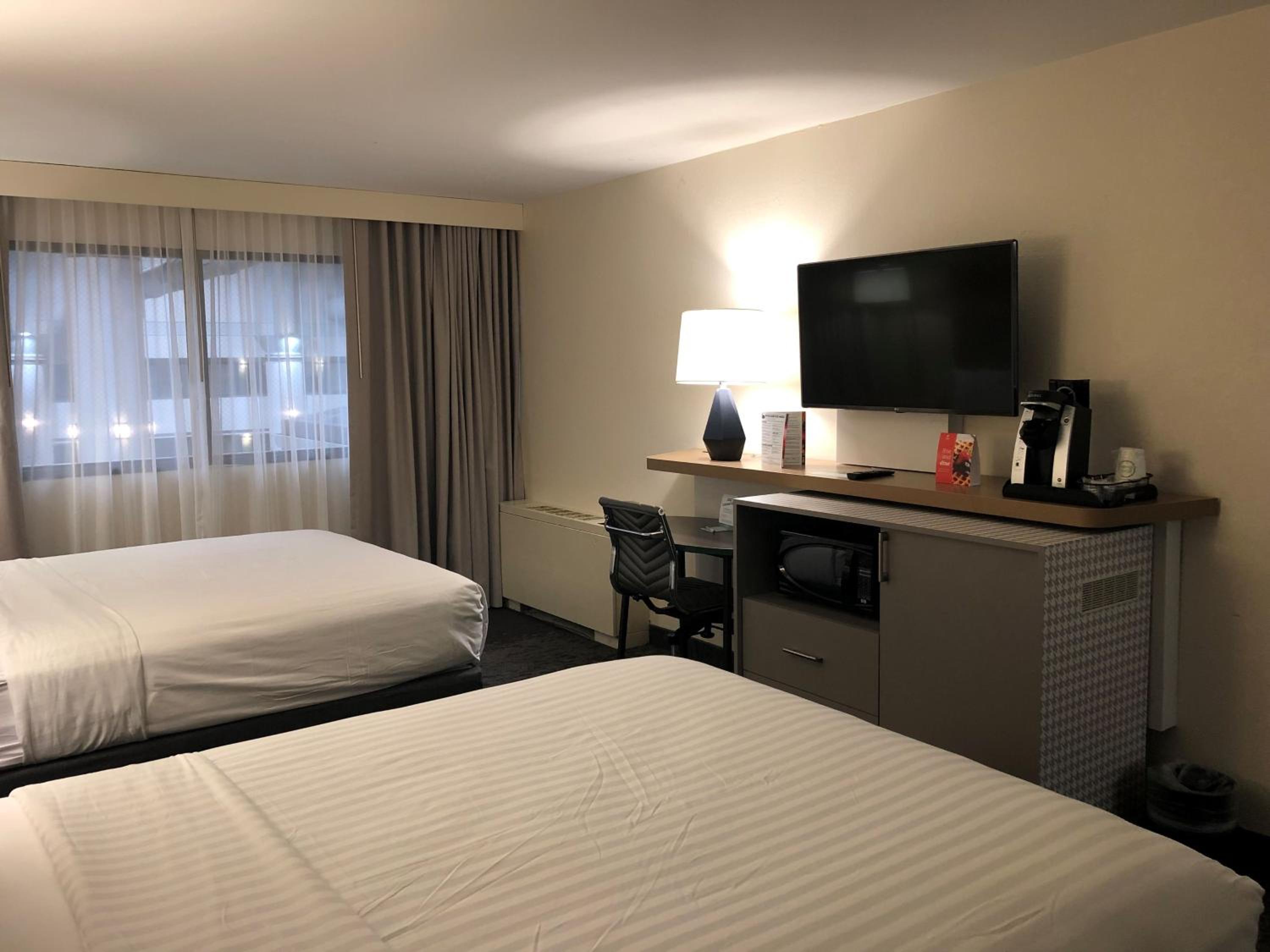 Premium Queen Room with Two Queen Beds - Photo 1