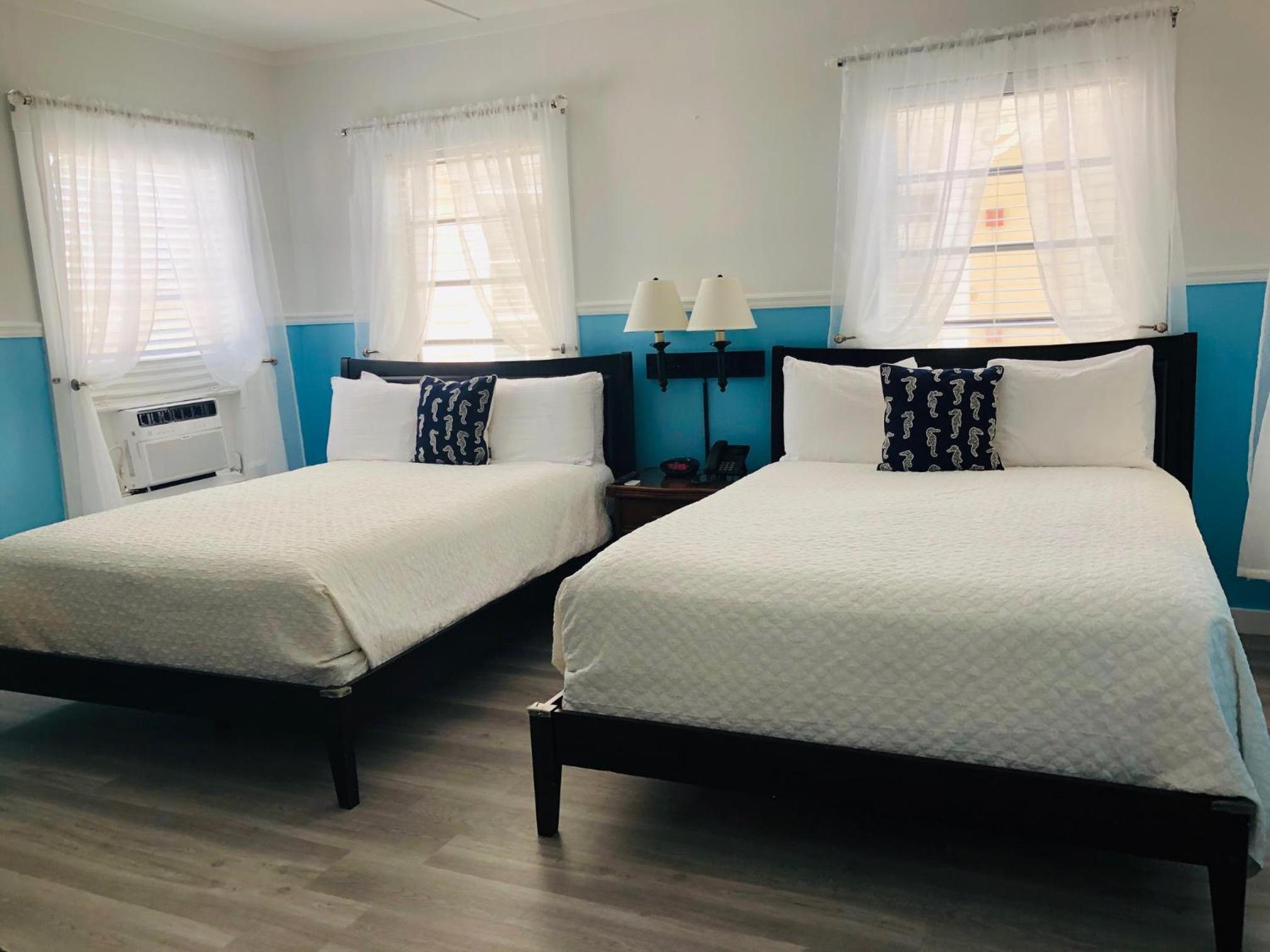Standard Queen Room with Two Queen Beds - Photo 1