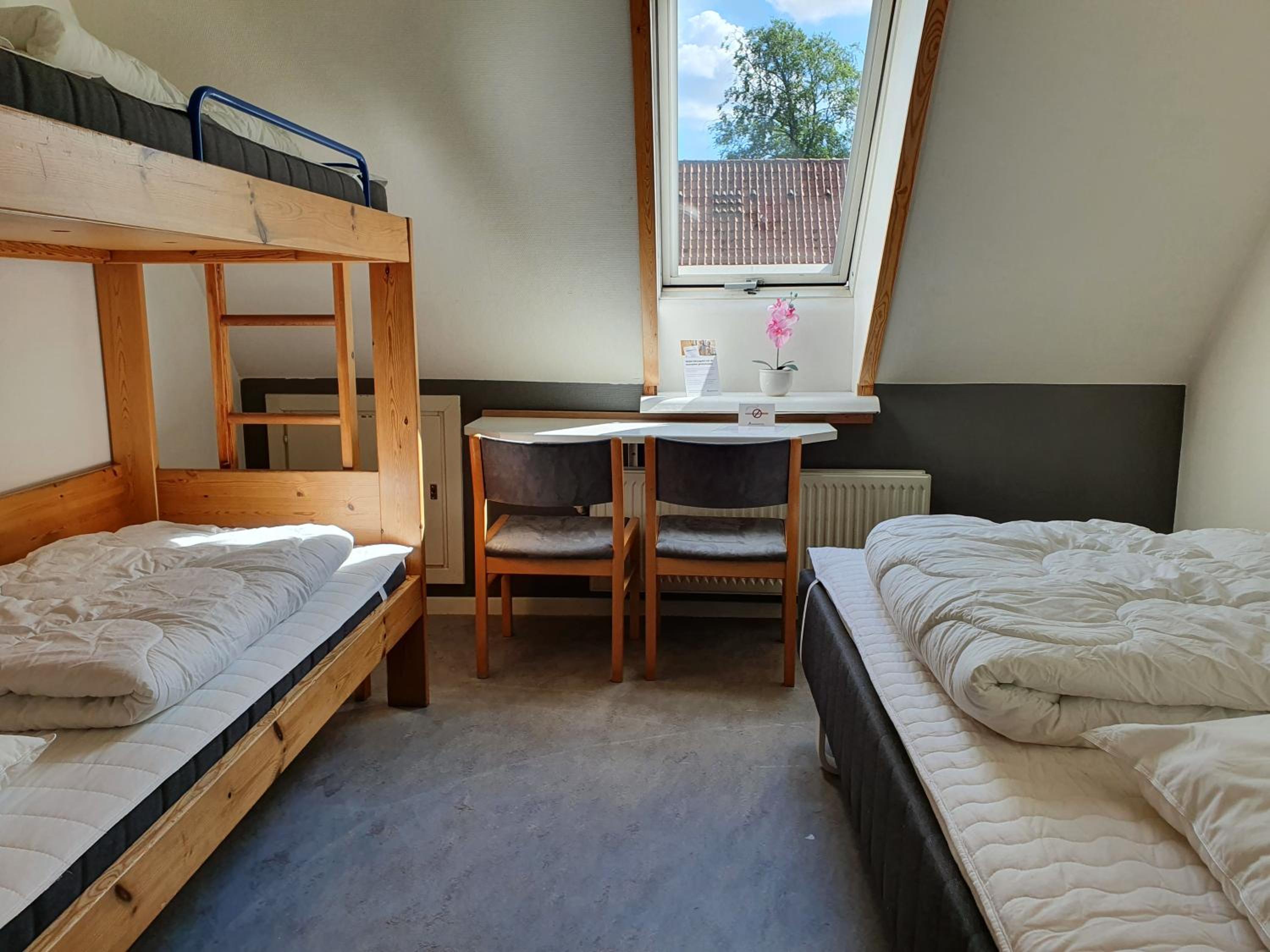 Quadruple Room with Private Bathroom - Photo 1