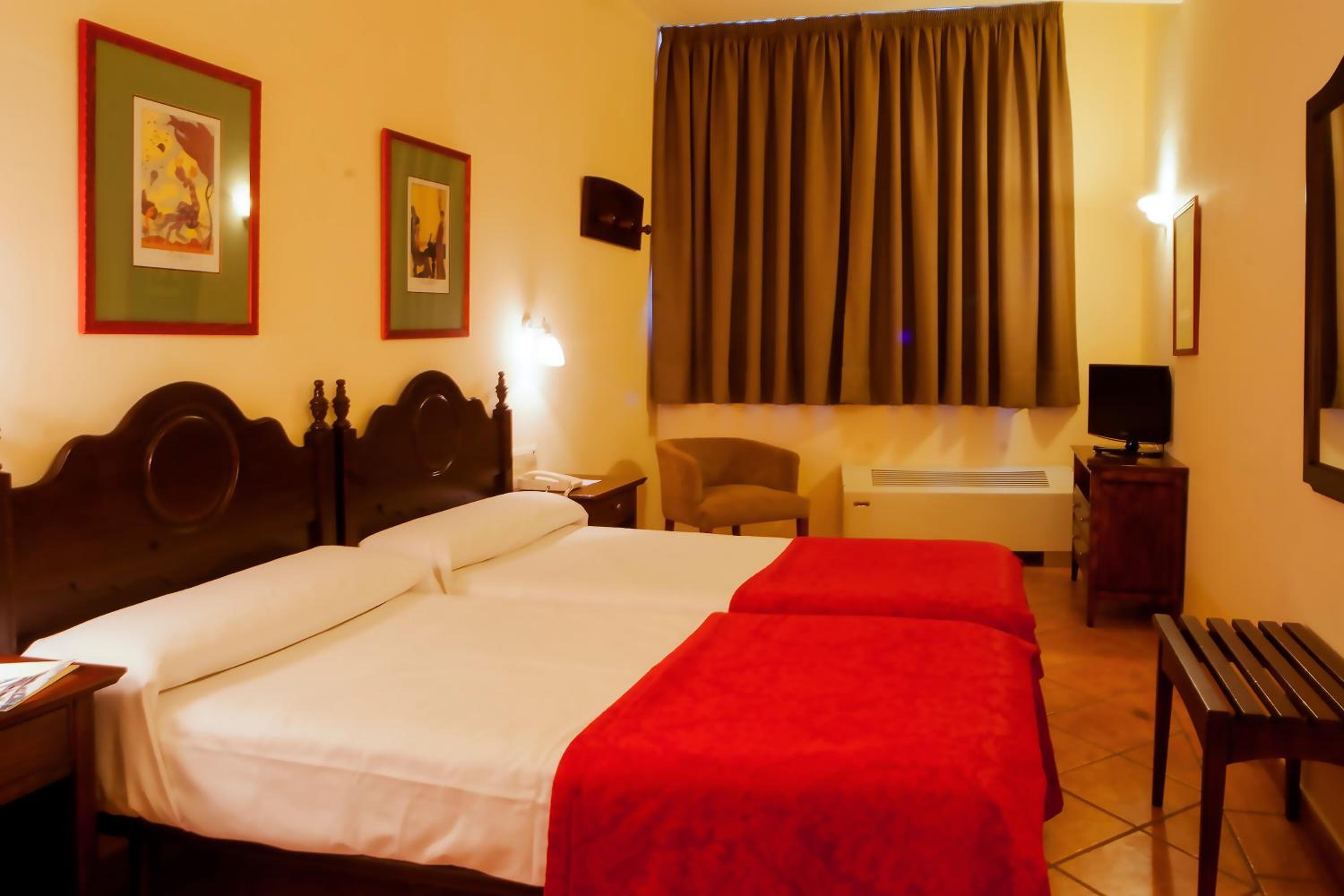 Habitación Doble o con Dos Camas (1 Adulto + 1 Niño)