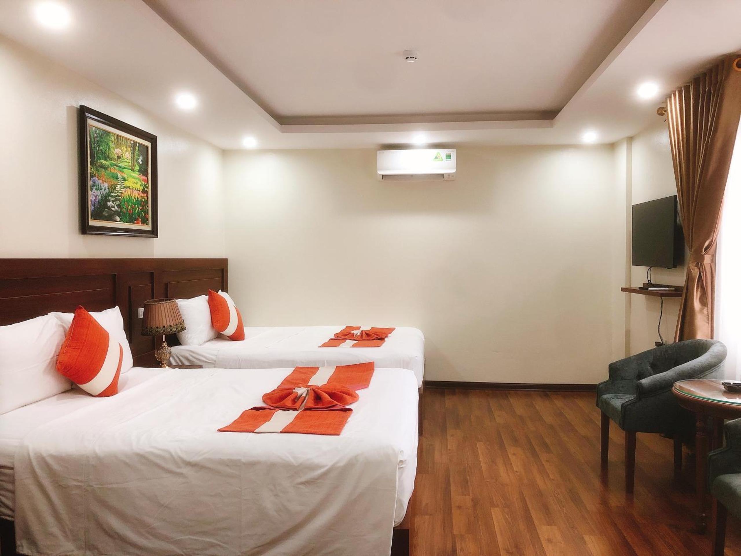Deluxe Queen Room with Two Queen Beds - Photo 1