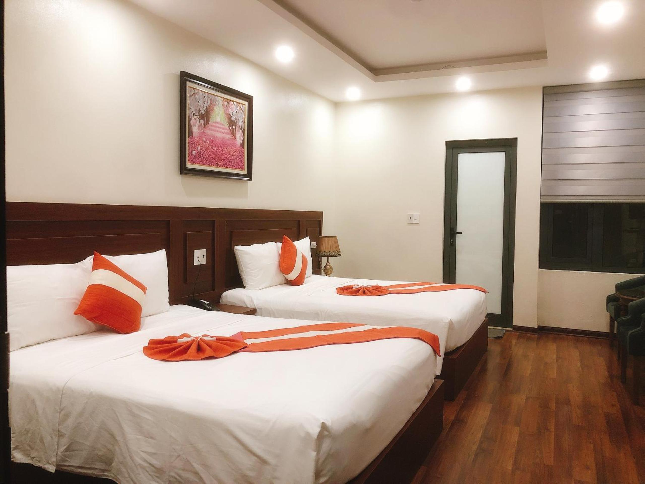 Standard Queen Room with Two Queen Beds - Photo 1