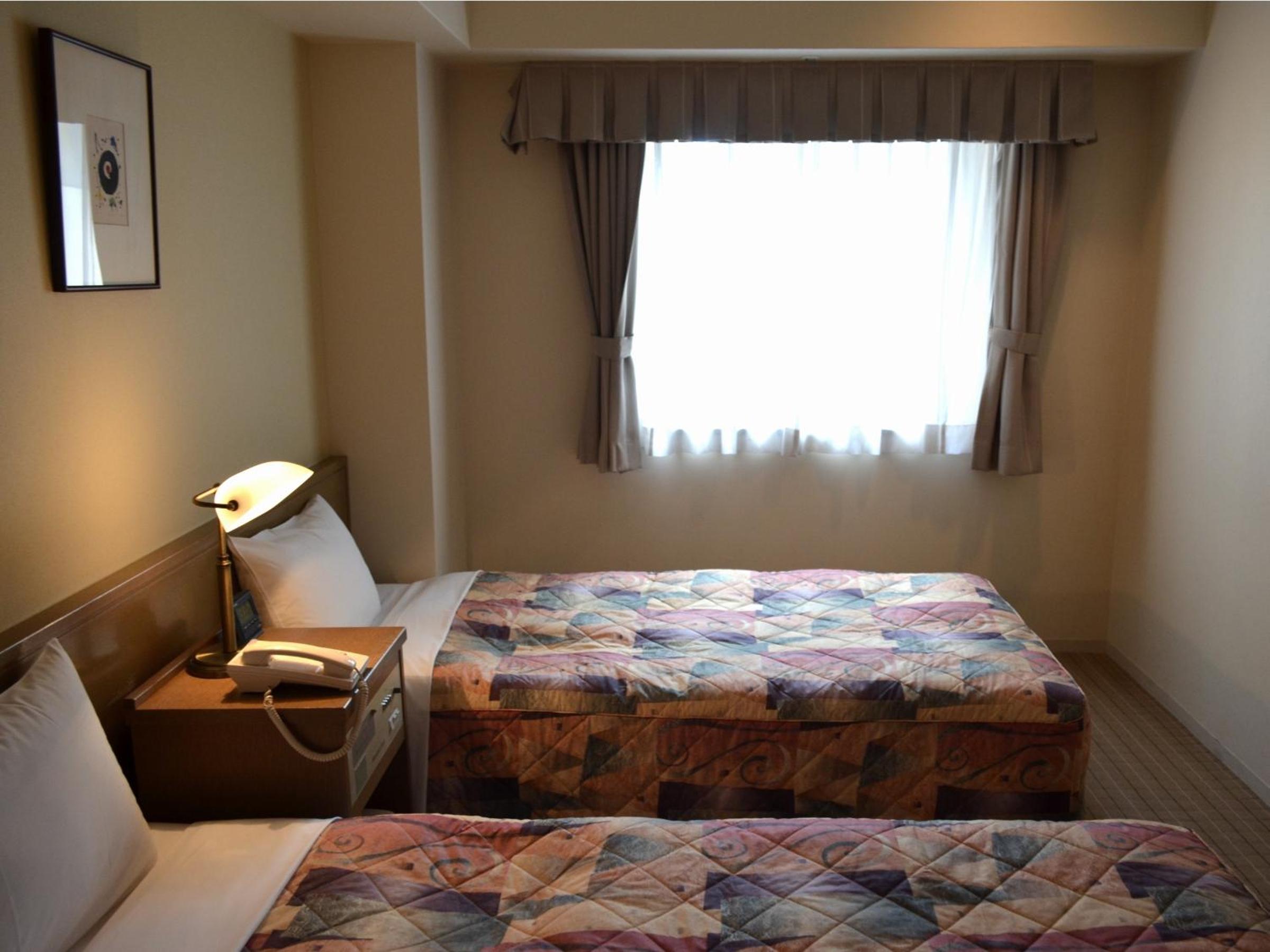 Economy Twin Room - Smoking photo 2