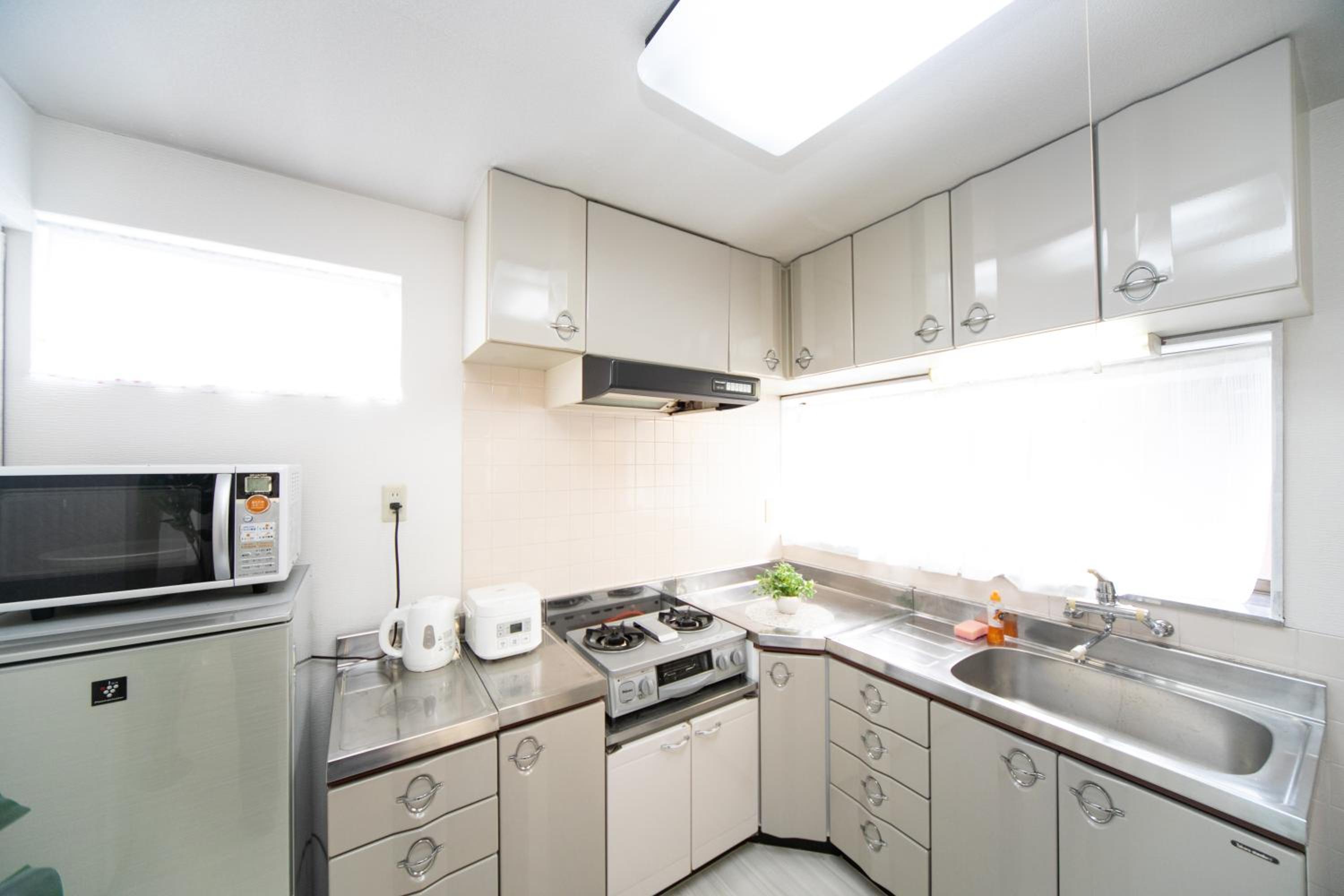 Three-Bedroom House - Photo 31