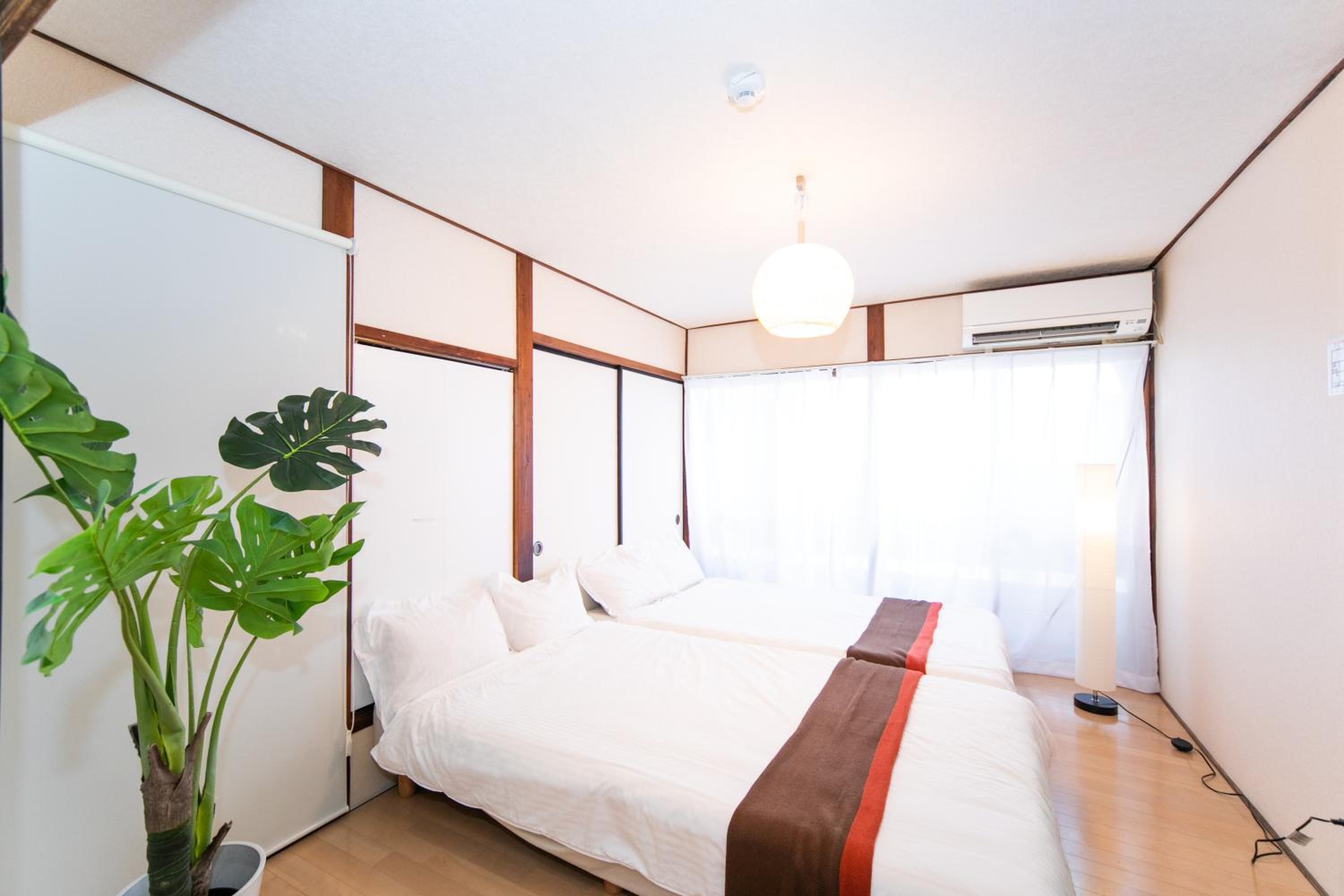 Three-Bedroom House - Photo 24