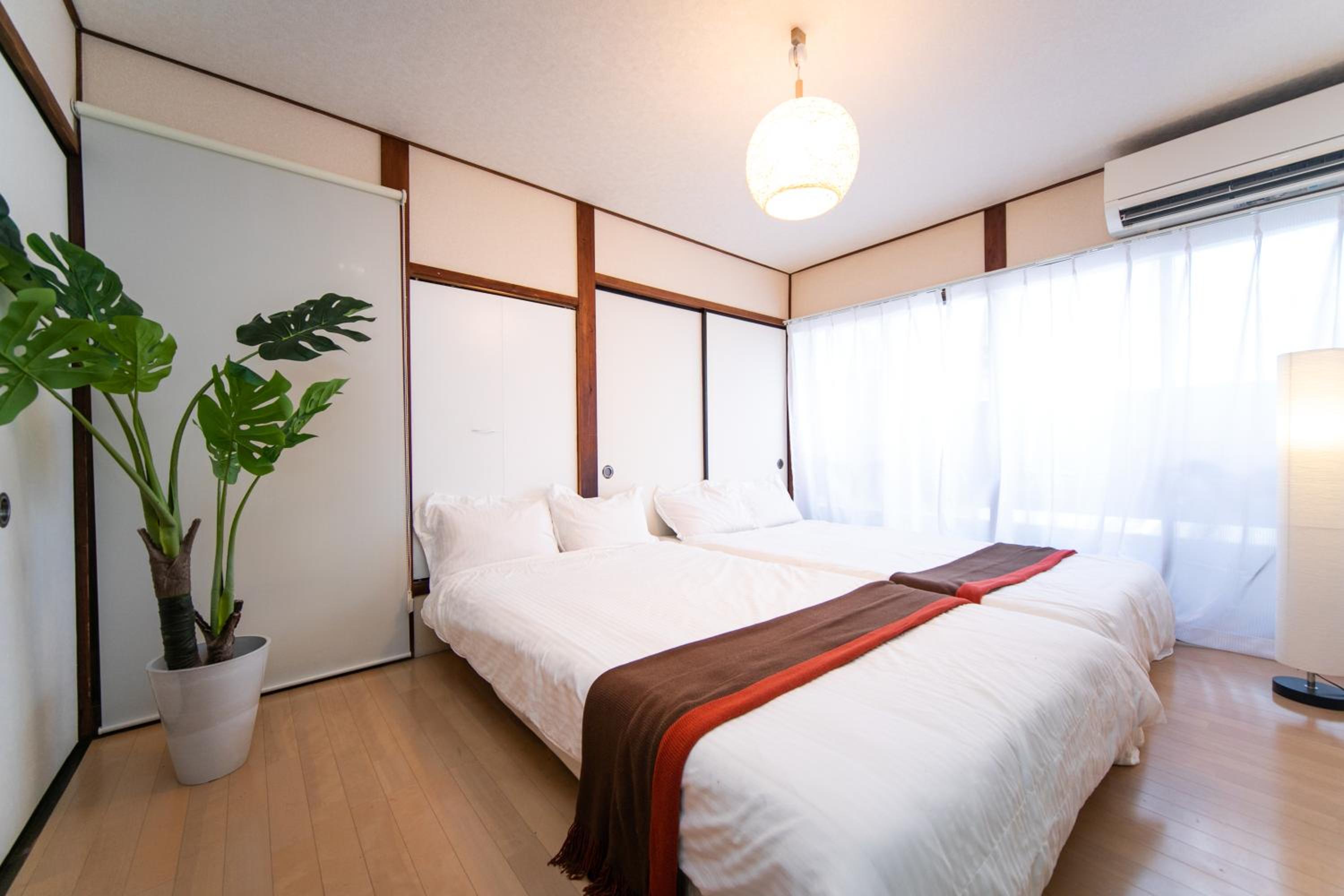 Three-Bedroom House - Photo 23