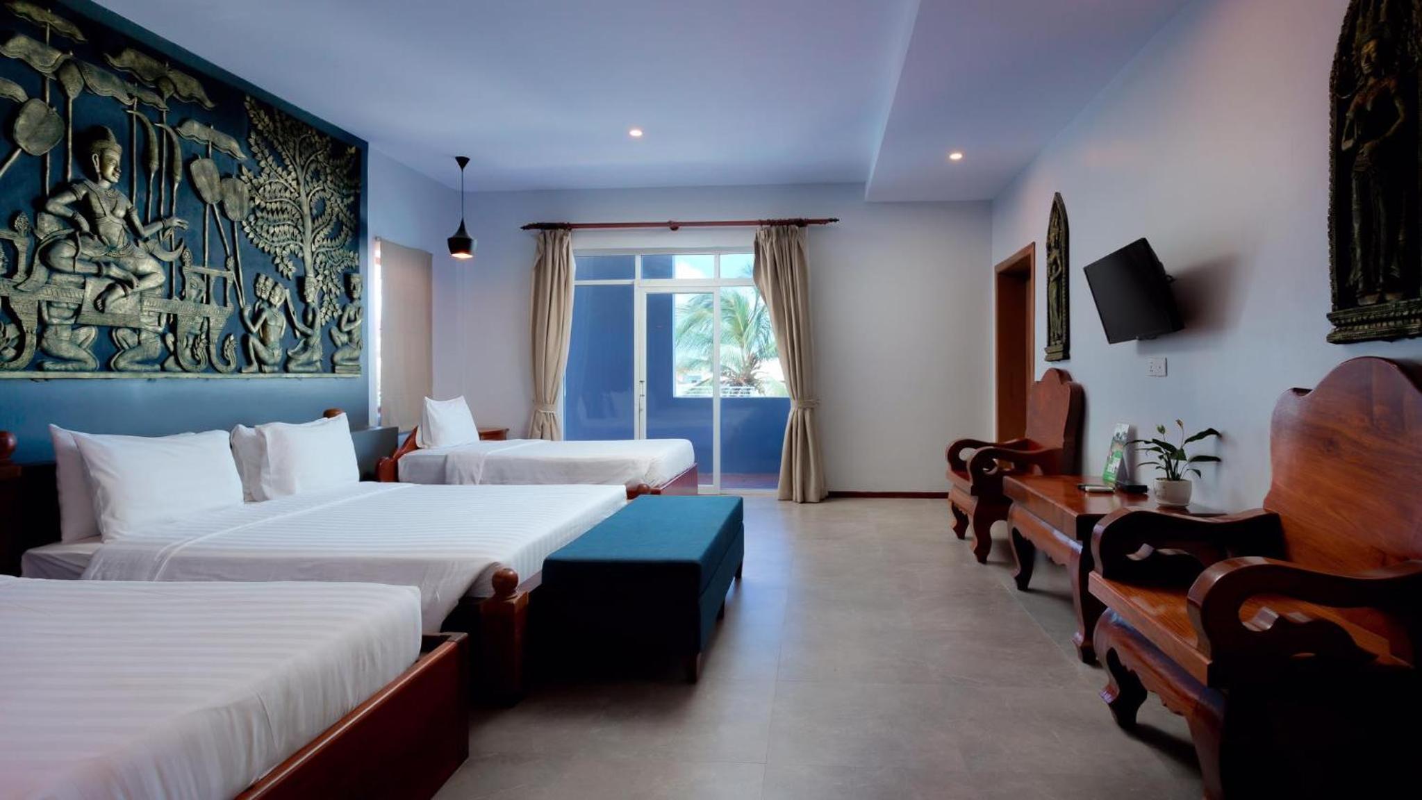 Deluxe Triple Room - Photo 11