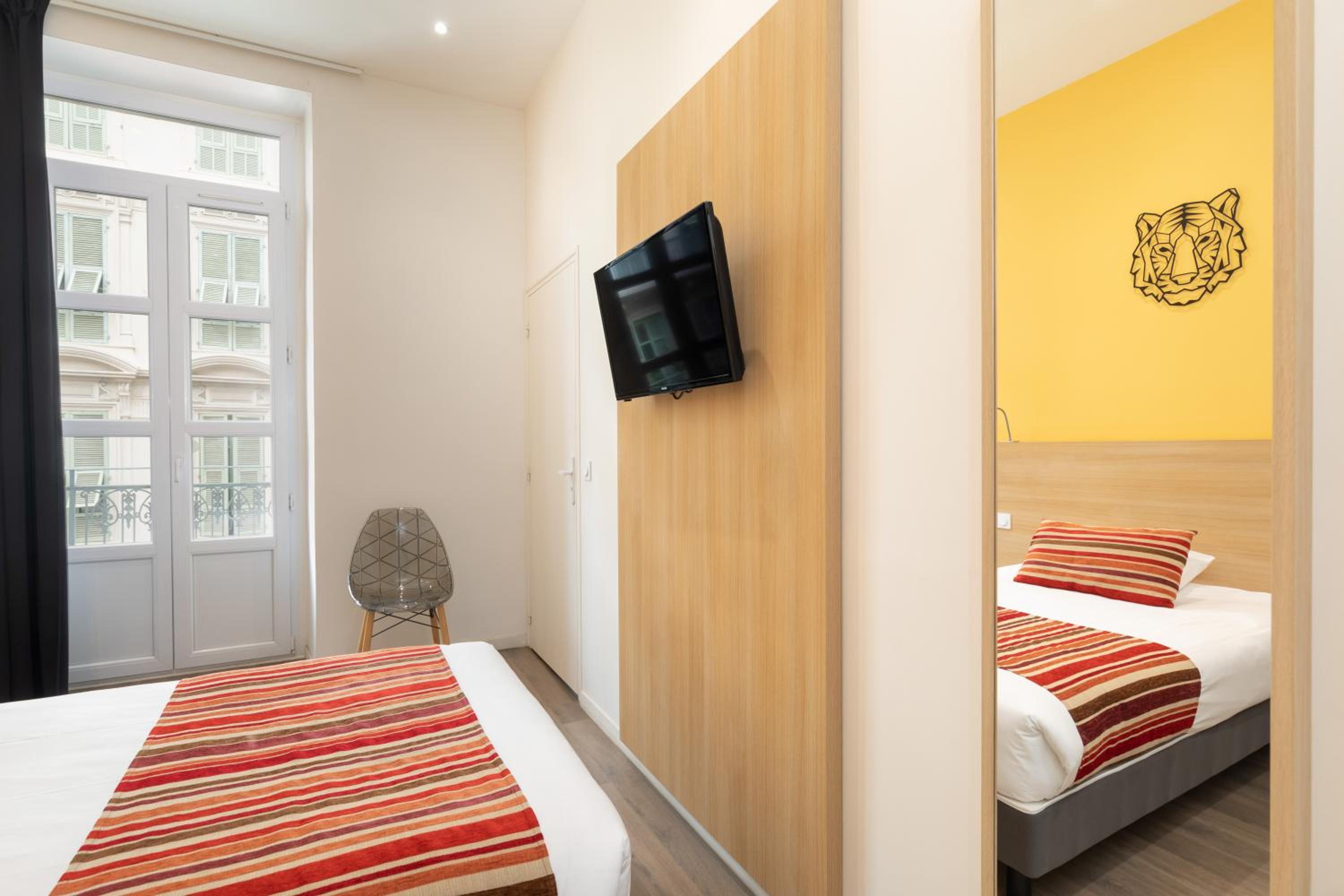 Cozy retreat with vibrant decor and modern comforts.