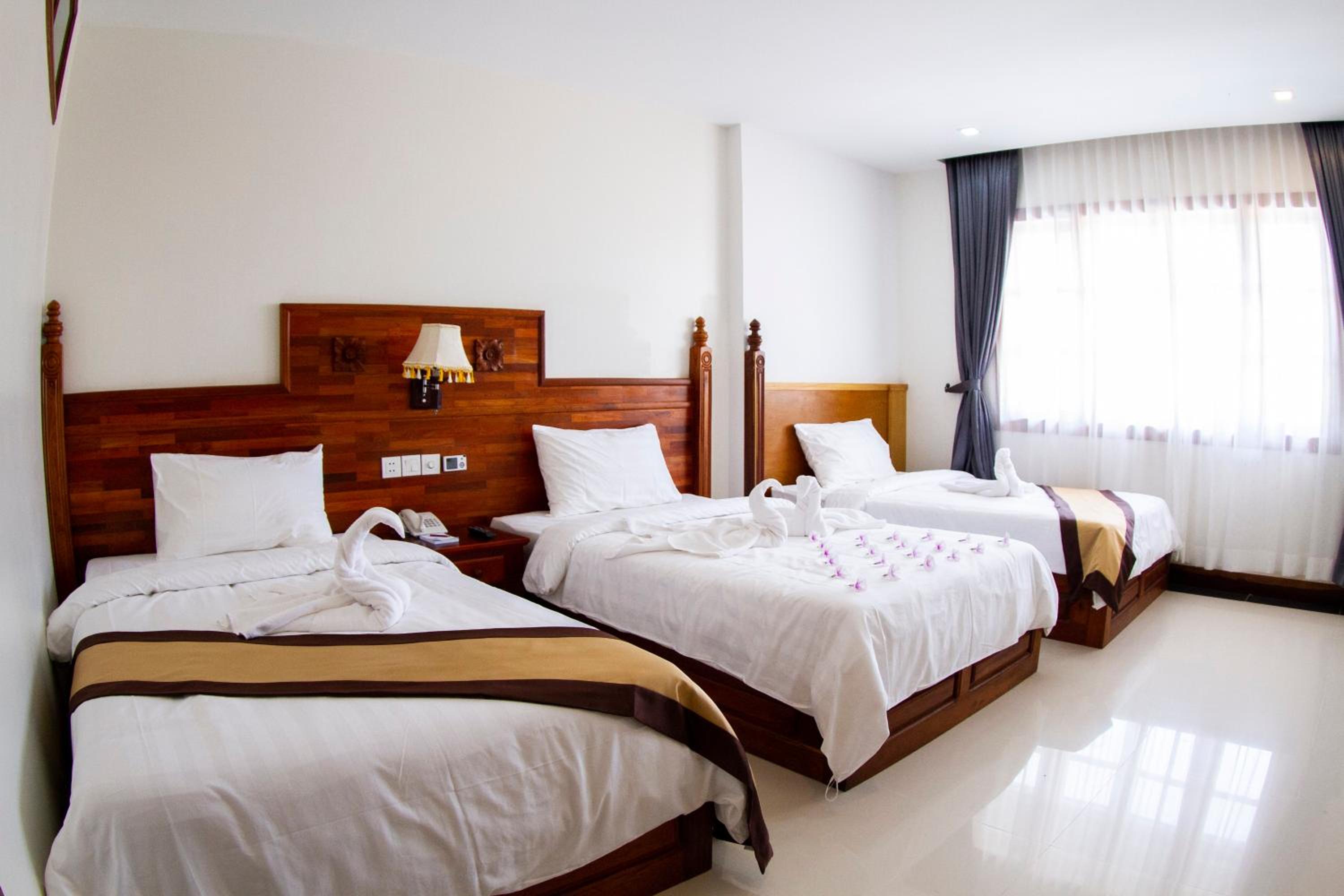 Deluxe Triple Room - Photo 9