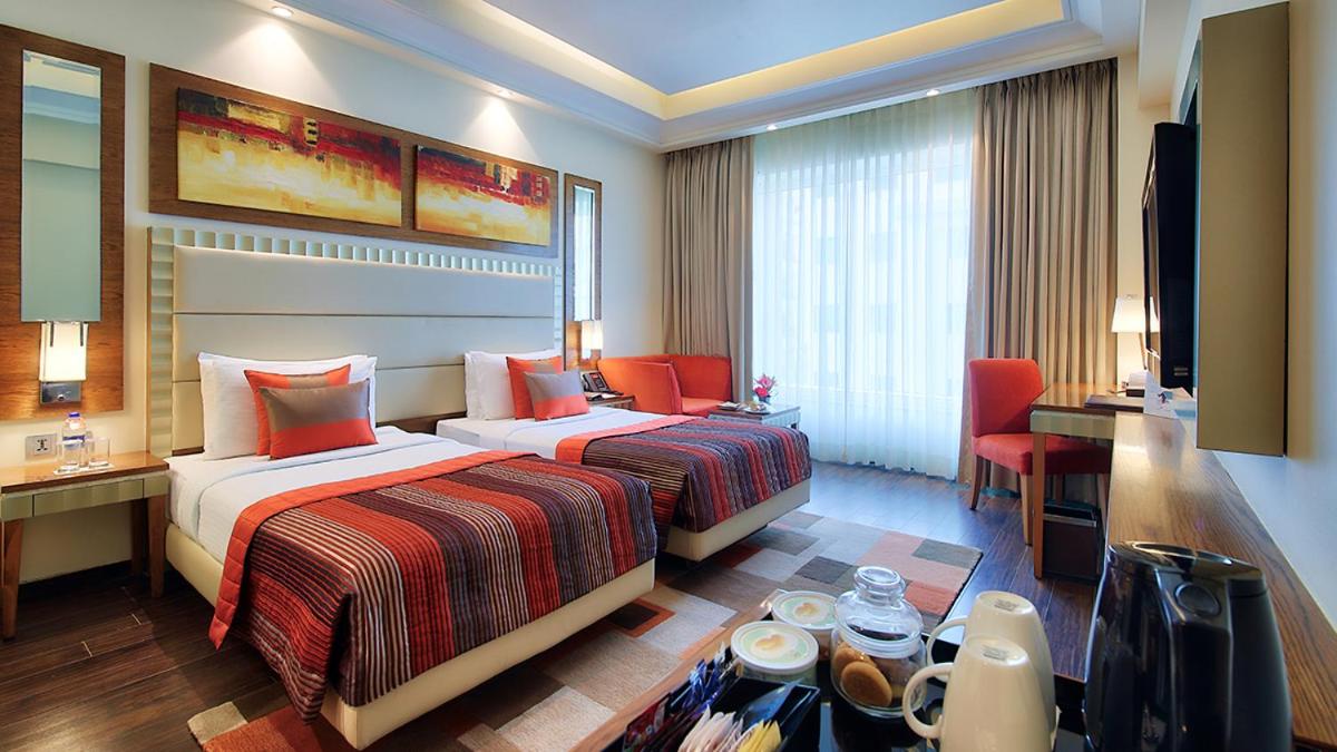 Executive Twin Room - Non-Smoking with 15 % OFF ON FOOD & Soft beverages/15% off on Laundry services//1+1 happy hours at Kokkinos from 6-8 pm on IMFL drinks// INR 500 SPA discount