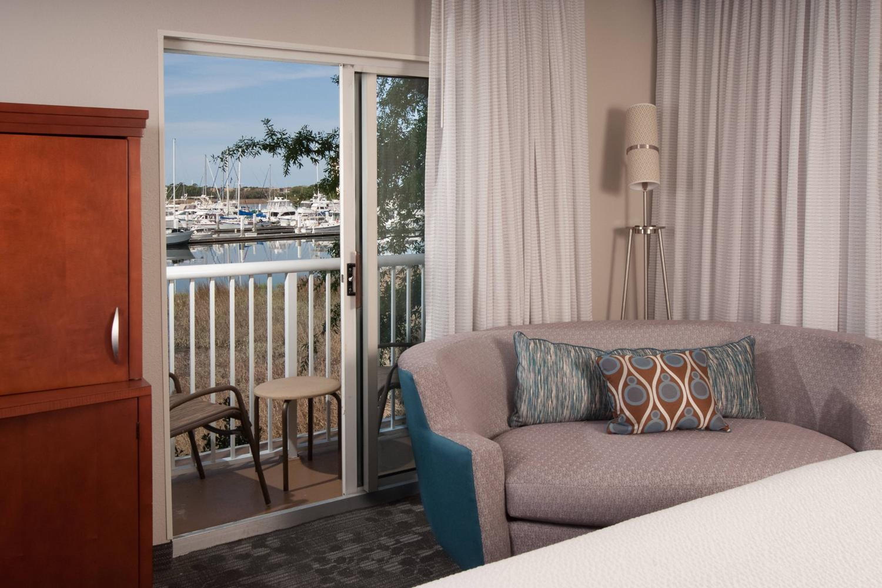 Larger Corner King Room with Water View, Balcony and Sofa Bed
