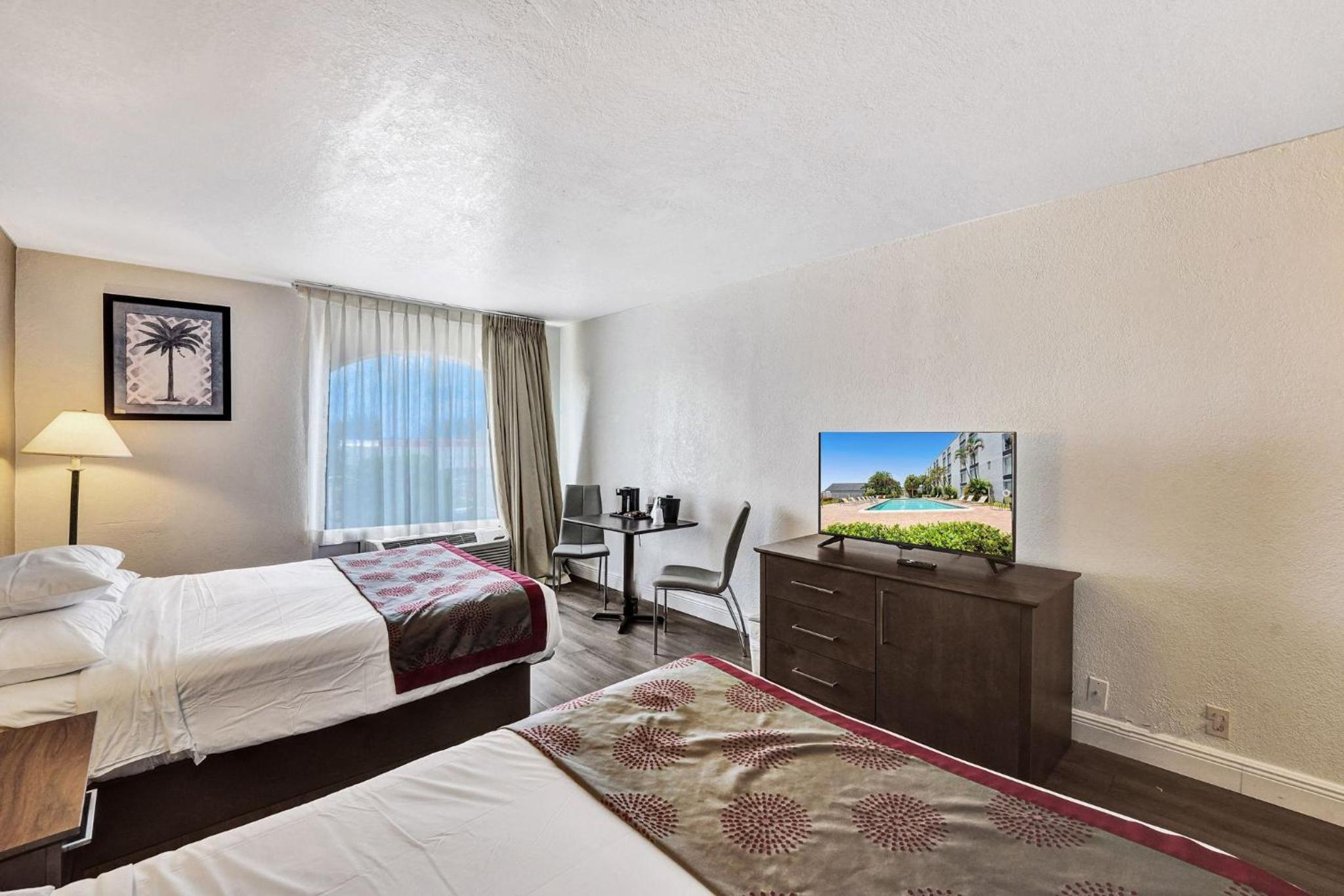 Deluxe Queen Room with Two Queen Beds - Photo 1