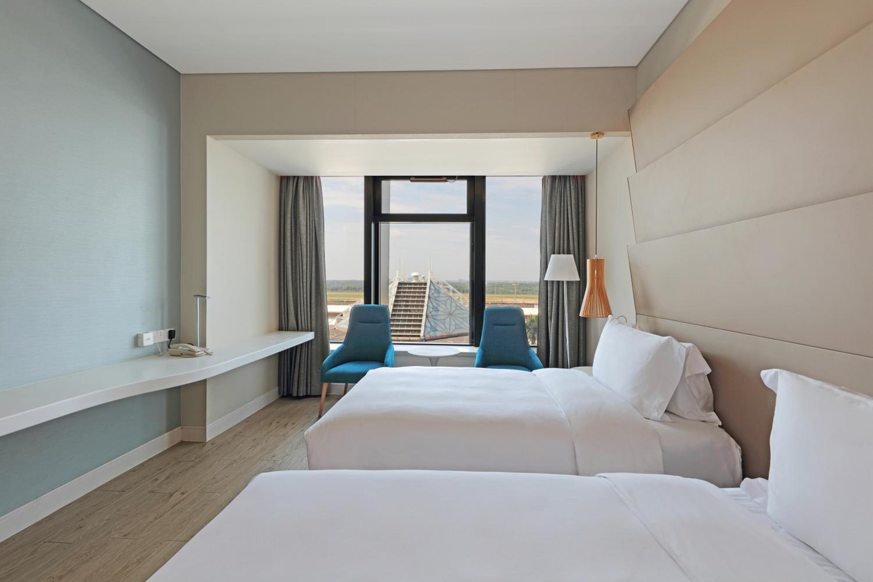 Deluxe Twin Room (5mins Walk to Meilan Airport) - Photo 1