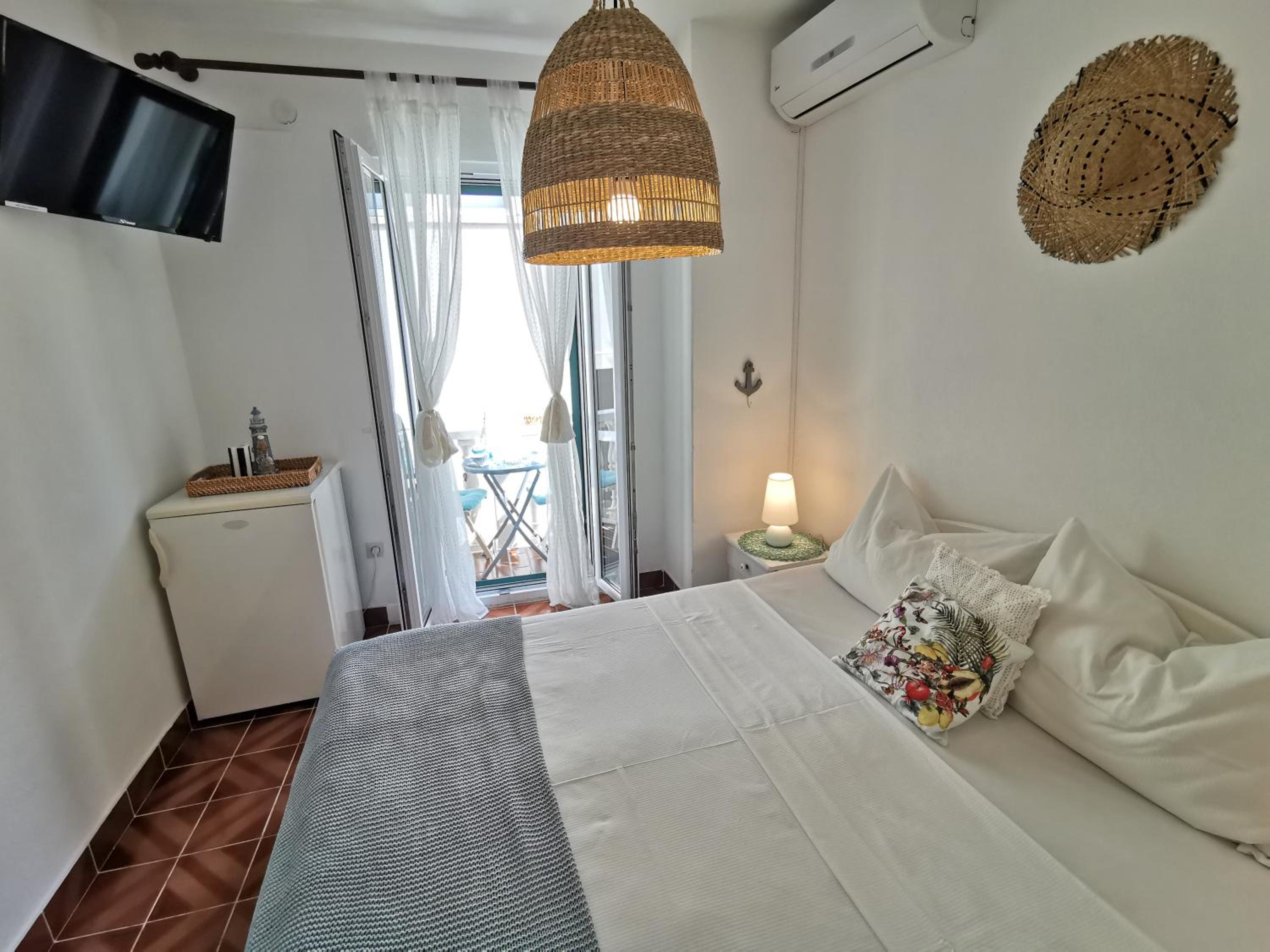 Quarto Duplo com Varanda e Vista para o Jardim