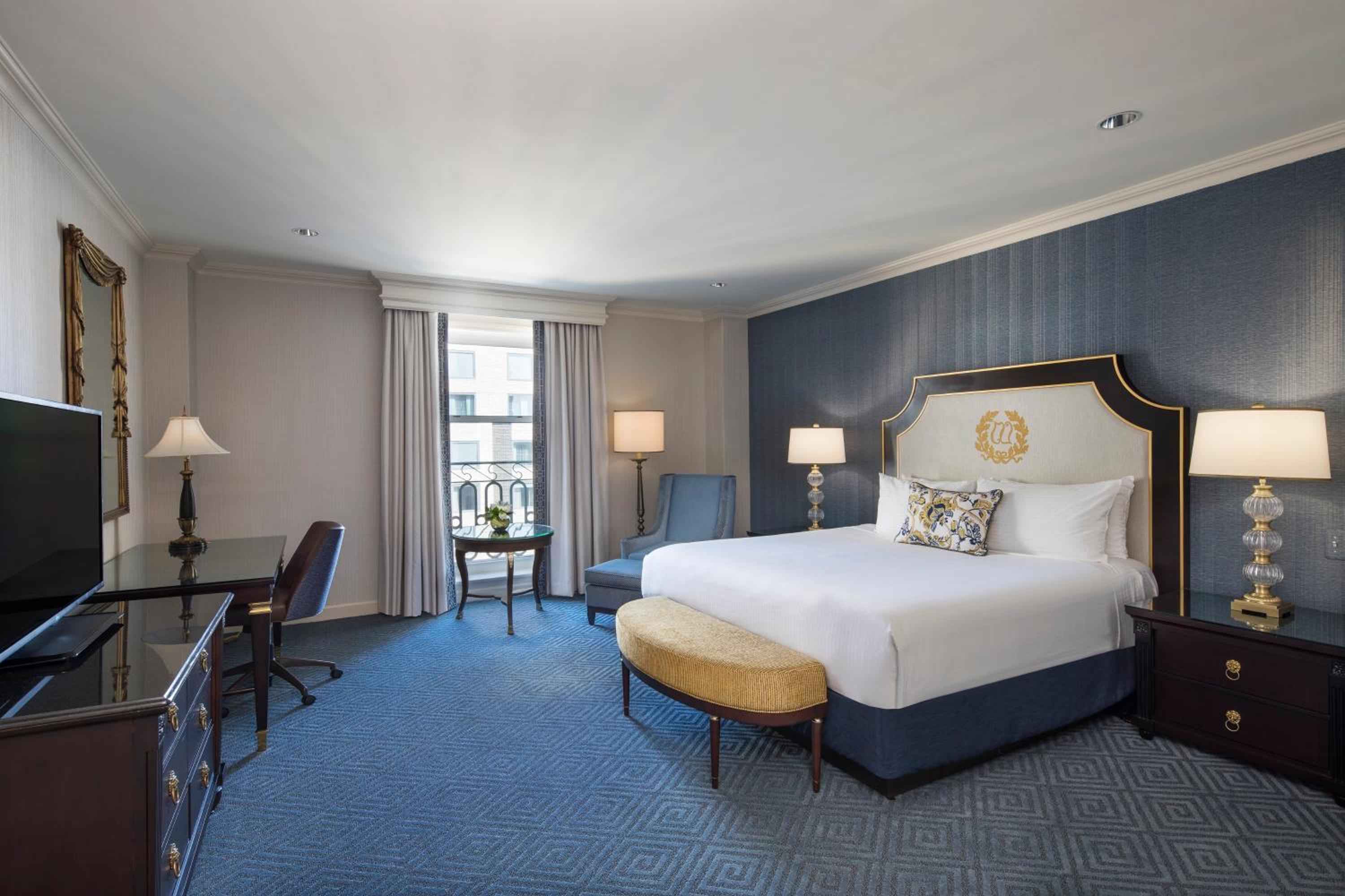 hotel room with a large bed and a flat screen tv